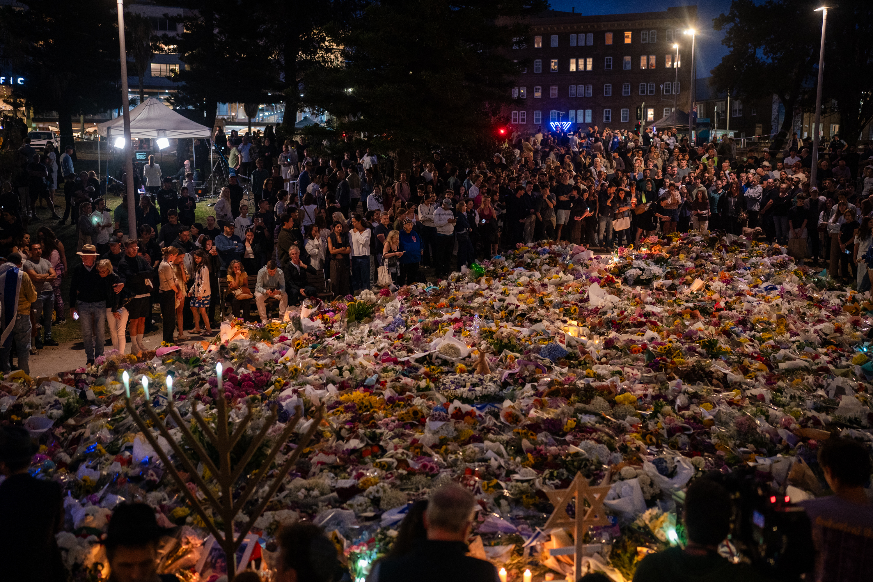 Floral tributes and candles are placed at Bondi Pavilion at Bondi Beach on December 16, 2025, in Sydney, Australia | Source: Getty Images
