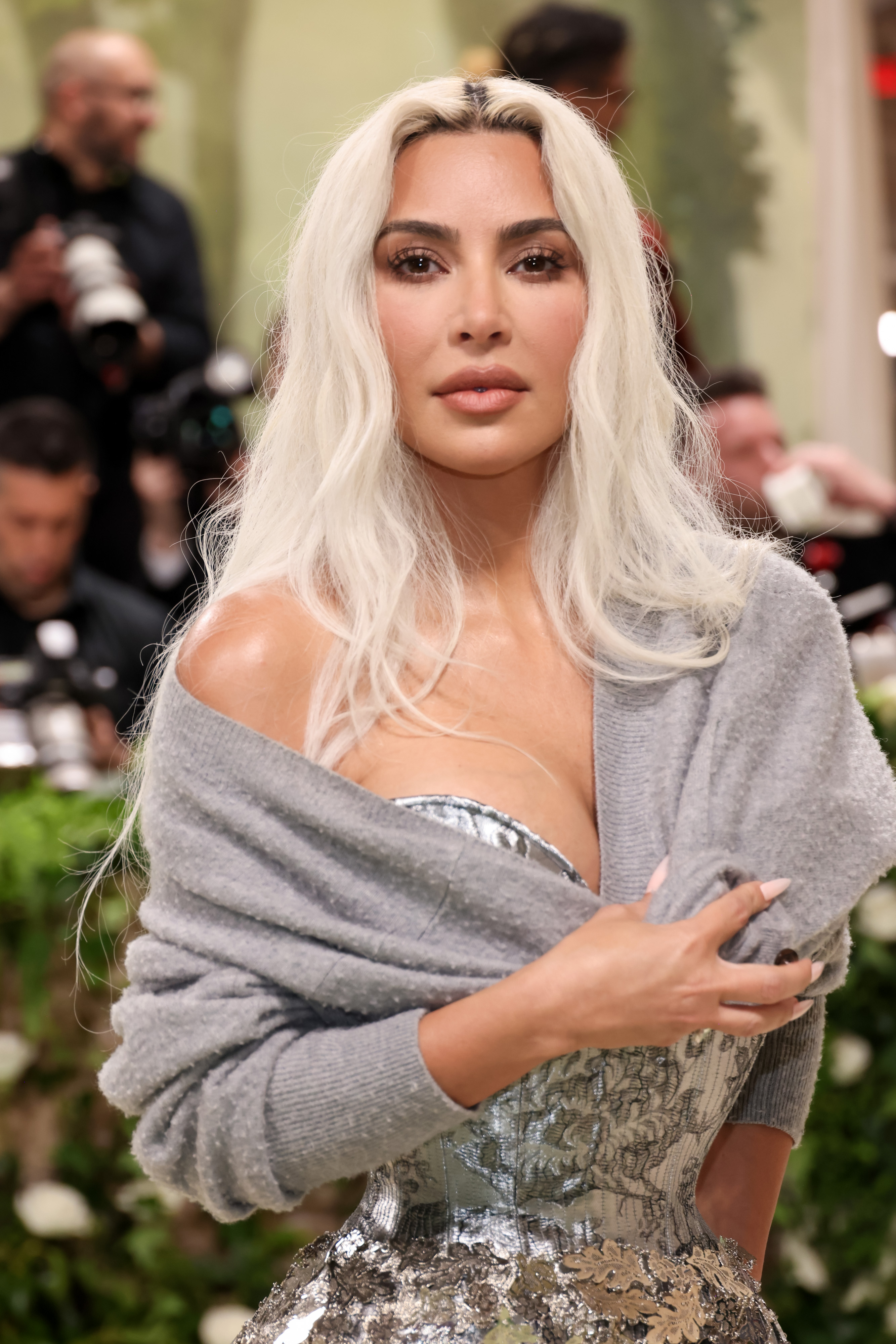 Kim Kardashian, 43, attended the Met Gala on May 6, 2024, in New York City. Her face featured a smooth, pale complexion with a slightly puffier upper lip and wider-looking face, as compared to previous photos.