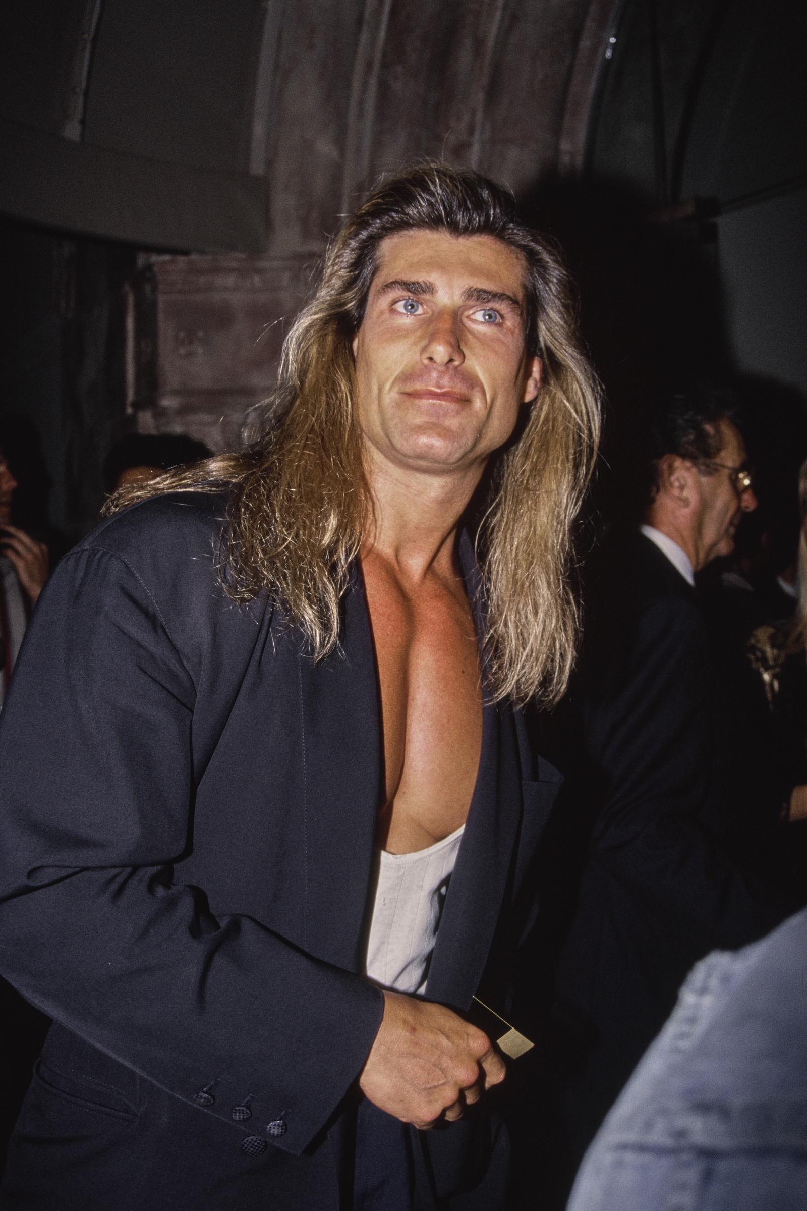 Another opportunity came just as quickly for the male model. In this photo, the iconic romance book cover star attended the "Pauly Does Dallas" premiere after party at the Comedy Store in Los Angeles, California, on August 26, 1992. | Source: Getty Images