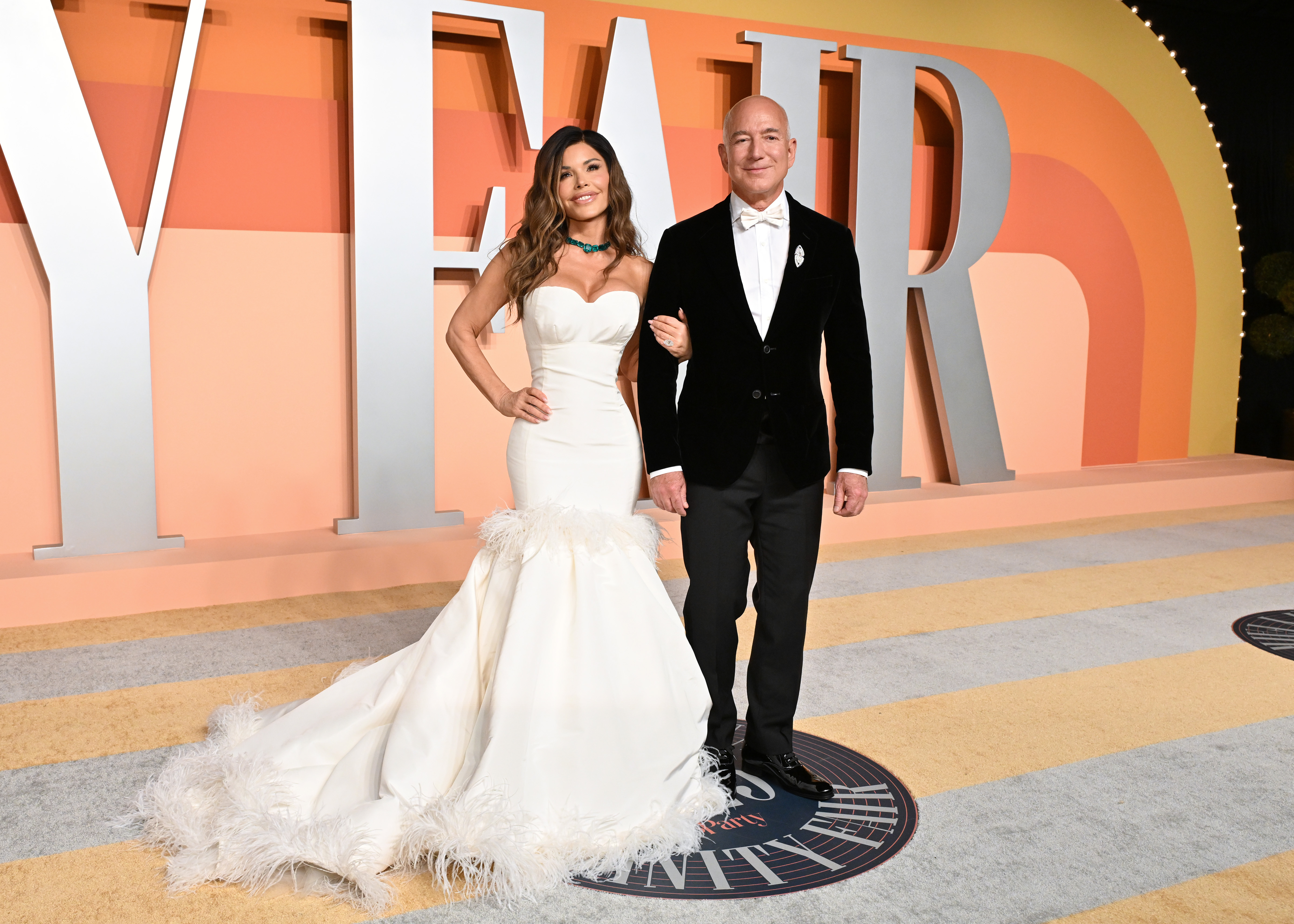 Lauren Sanchez and Jeff Bezos pose together at the 2025 Vanity Fair Oscar Party hosted by Radhika Jones at the Wallis Annenberg Center for the Performing Arts on March 2, 2025, in Beverly Hills, California | Source: Getty Images