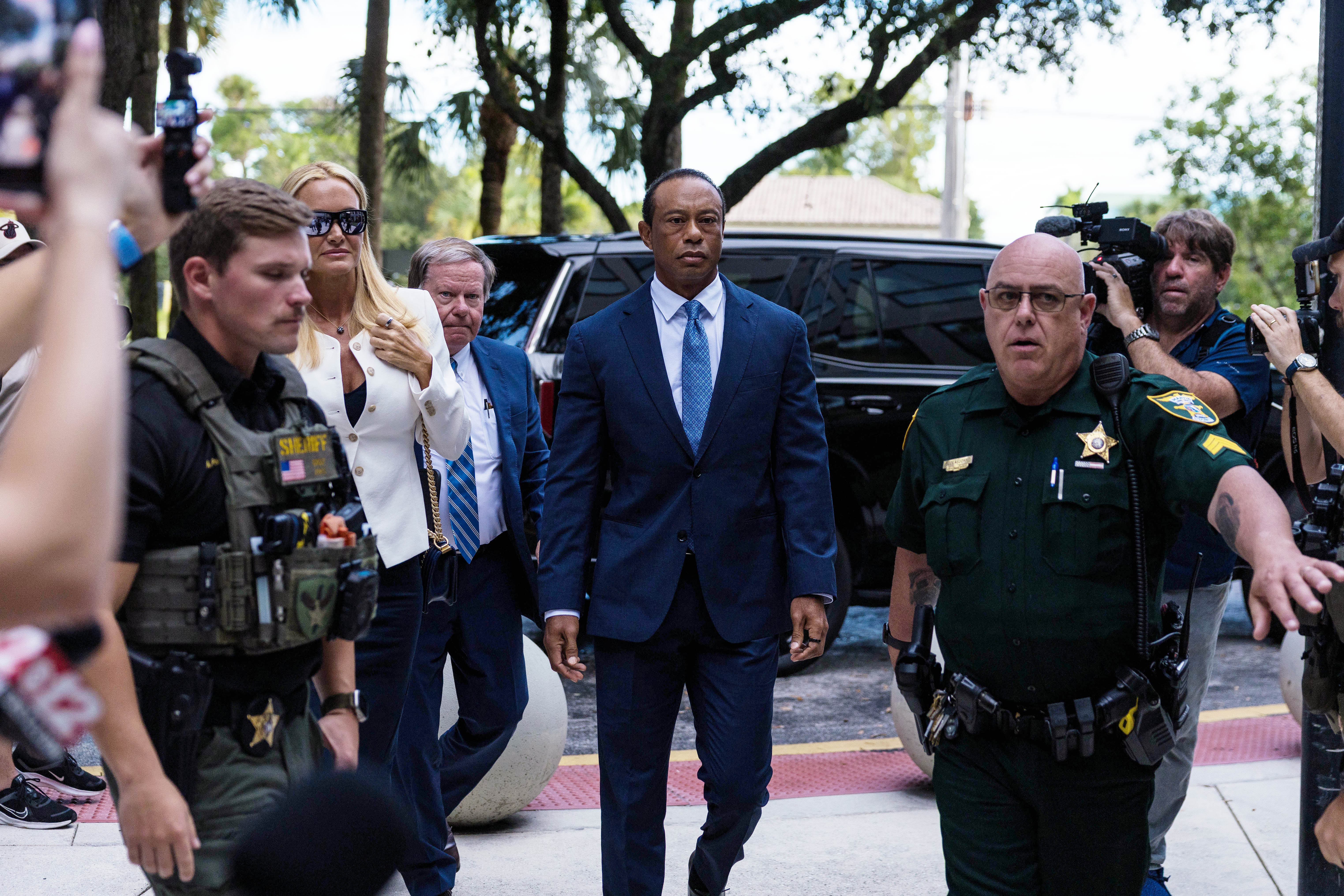 The courthouse cameras captured Woods moving forward with a stony, tightly controlled expression, while Vanessa remained just behind him as reporters closed in around the couple. | Source: Getty Images