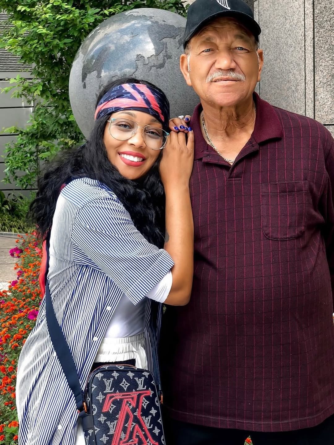 Monica posing for a photo with her dad, M.C. Arnold Jr. | Source: Instagram/monicadenise