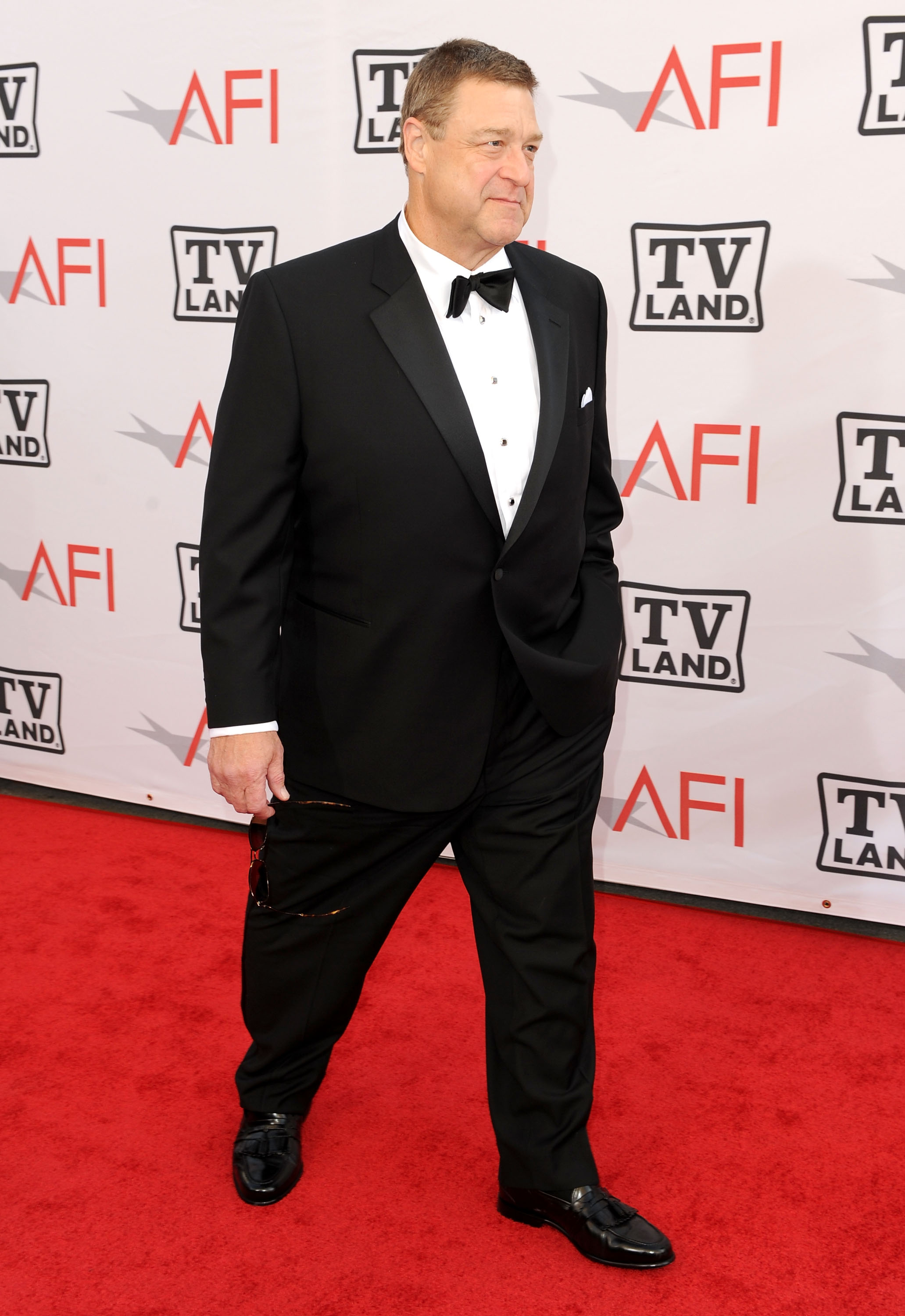 At the 38th AFI Life Achievement Award honoring Mike Nichols in Culver City, Goodman appeared on the red carpet in a black tuxedo and bow tie. The formal look offered another clear view of his changing physique as his long-term transformation began to emerge publicly.