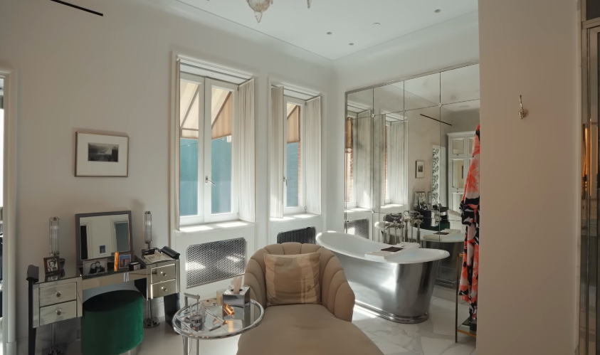The primary bath is indulgent without apology. It is also where the home's glamour becomes most theatrical. | Source: YouTube/Architectural Digest