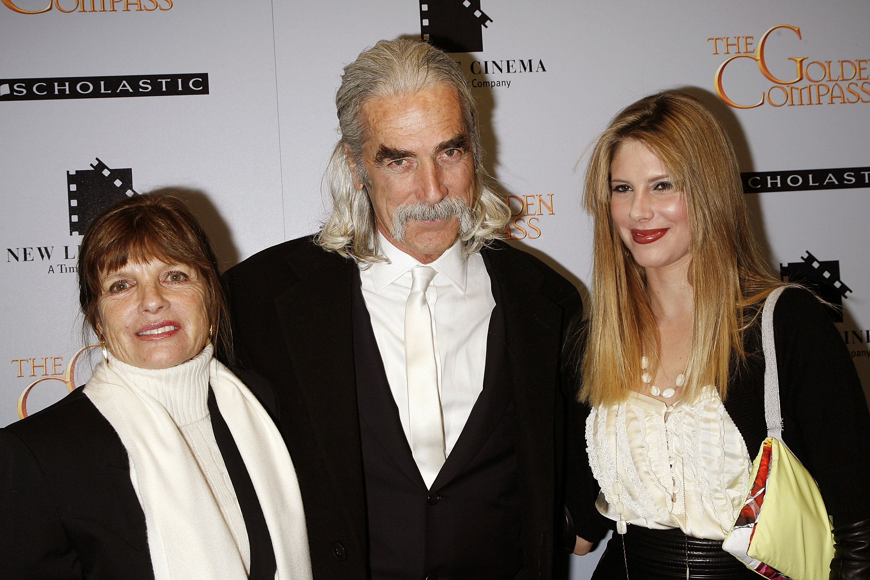 Katharine Ross, Sam Elliott, and their daughter Cleo Rose Elliott arrived together in style at "The Golden Compass" premiere held at the Ziegfeld Theater on December 2, 2007, in New York City. The family coordinated in winter-ready black-and-white looks, with Sam looking sharp in a black suit, waistcoat, and white tie, flanked by Katharine in a cozy white turtleneck draped with a pale scarf and Cleo radiant in a ruffled cream top, black cardigan, and a colorful shoulder bag. | Source: Getty Images