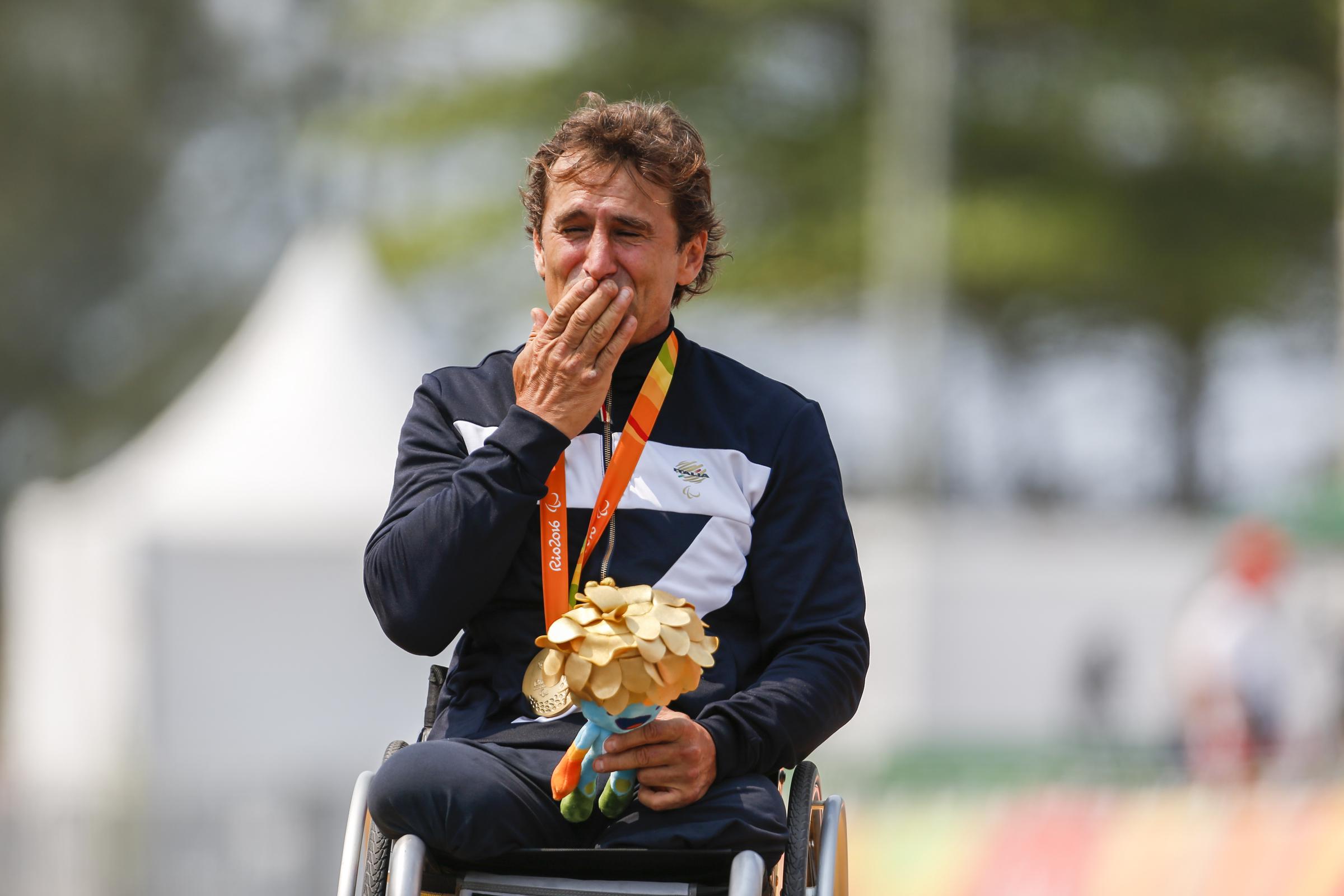 Alex Zanardi celebrates on the podium at the medal ceremony for the Men's Road Race H5 on Day 8 of the Rio 2016 Paralympic Games at Pontal in Rio de Janeiro, Brazil, on September 15, 2016. | Source: Getty Images