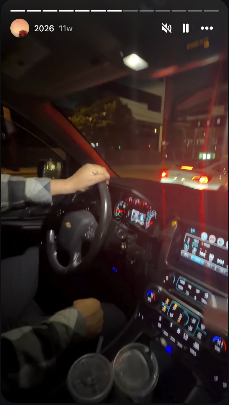 Amanda Bynes posted a nighttime video from inside a vehicle, capturing the driver behind the wheel as the car waited in traffic, with the illuminated dashboard, two drinks in the cup holders, and city lights visible ahead.