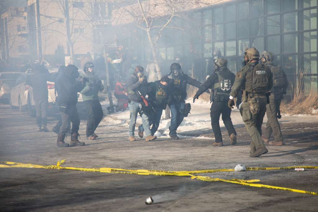 Agents deploy tear gas during a demonstration following the shooting of Alex Pretti. | Source: Getty Images