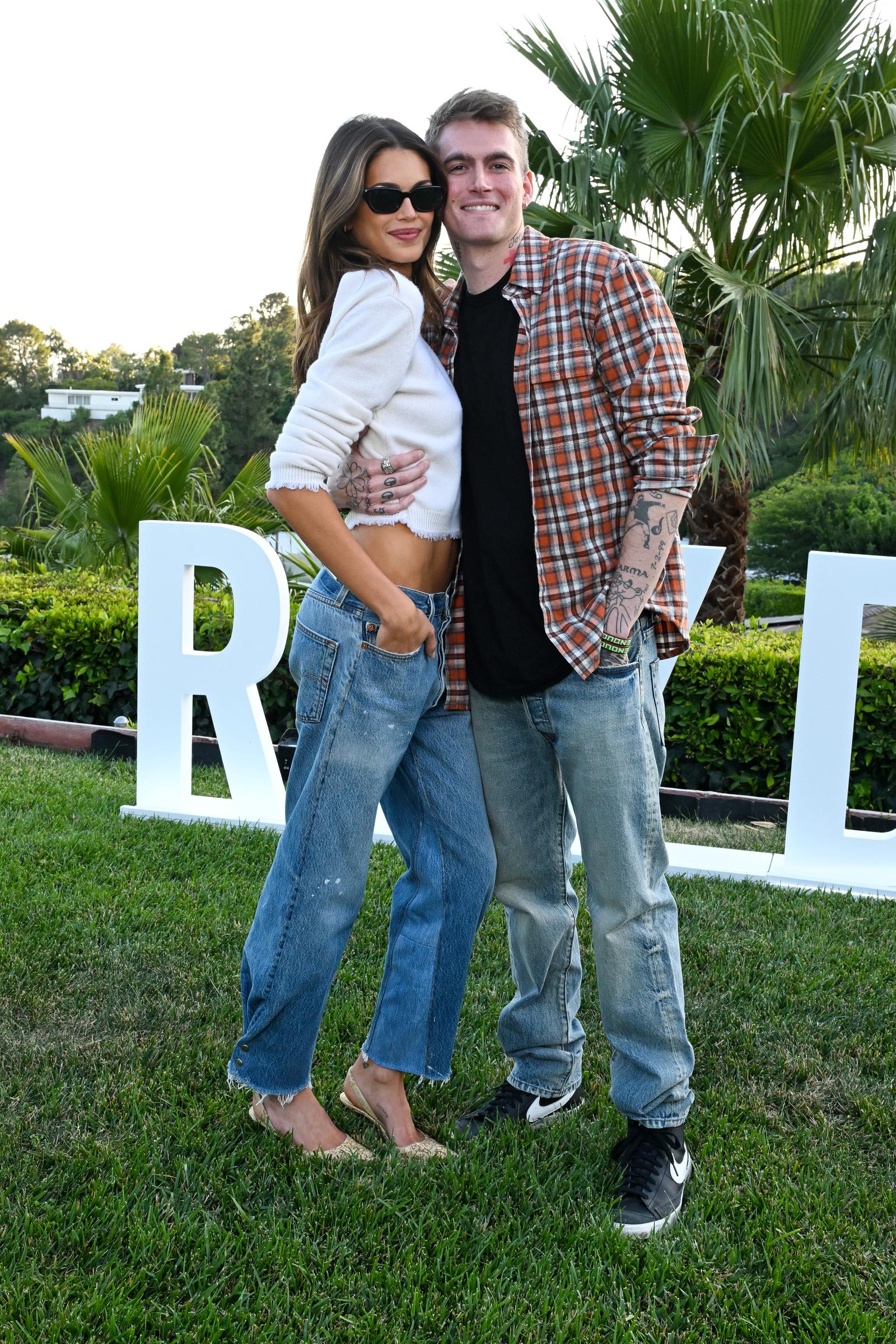 Presley Gerber and sister Kaia Gerber smiled warmly while embracing in relaxed denim styles at the RE/DONE x Kaia Gerber "Short/Cuts" launch event on May 20, 2026, in Los Angeles, California. | Source: Getty Images