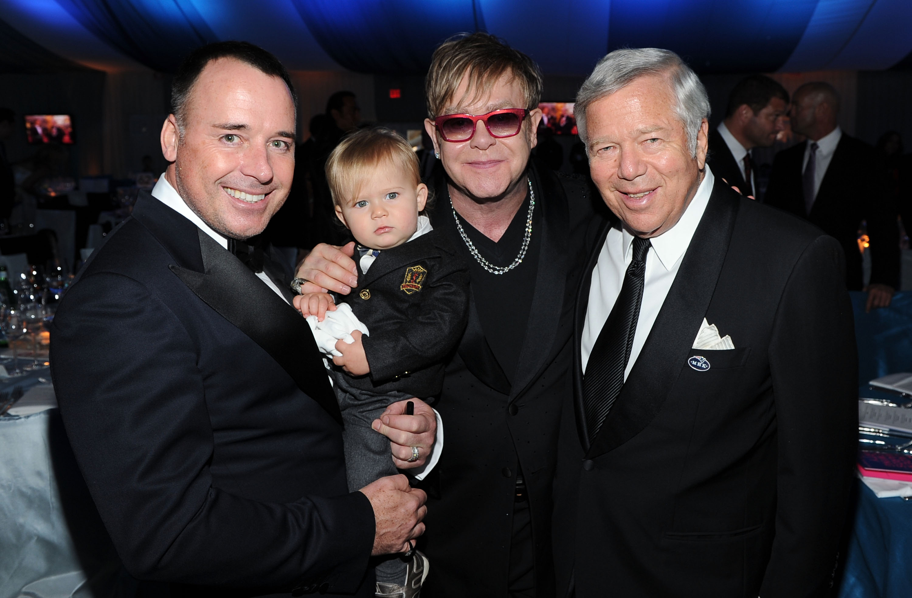 David Furnish and Elton John with their son, Zachary, and President and CEO of Kraft Group, Robert Kraft, at the 20th Annual Elton John AIDS Foundation Academy Awards Viewing Party on February 26, 2012, in Beverly Hills, California. | Source: Getty Images