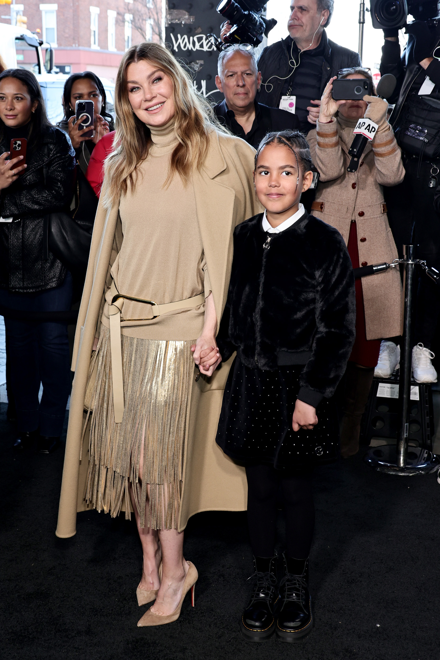 Ellen Pompeo and Sienna Ivery attend the Michael Kors Collection Fall/Winter Runway Show on February 15, 2023, in New York City. | Source: Getty Images