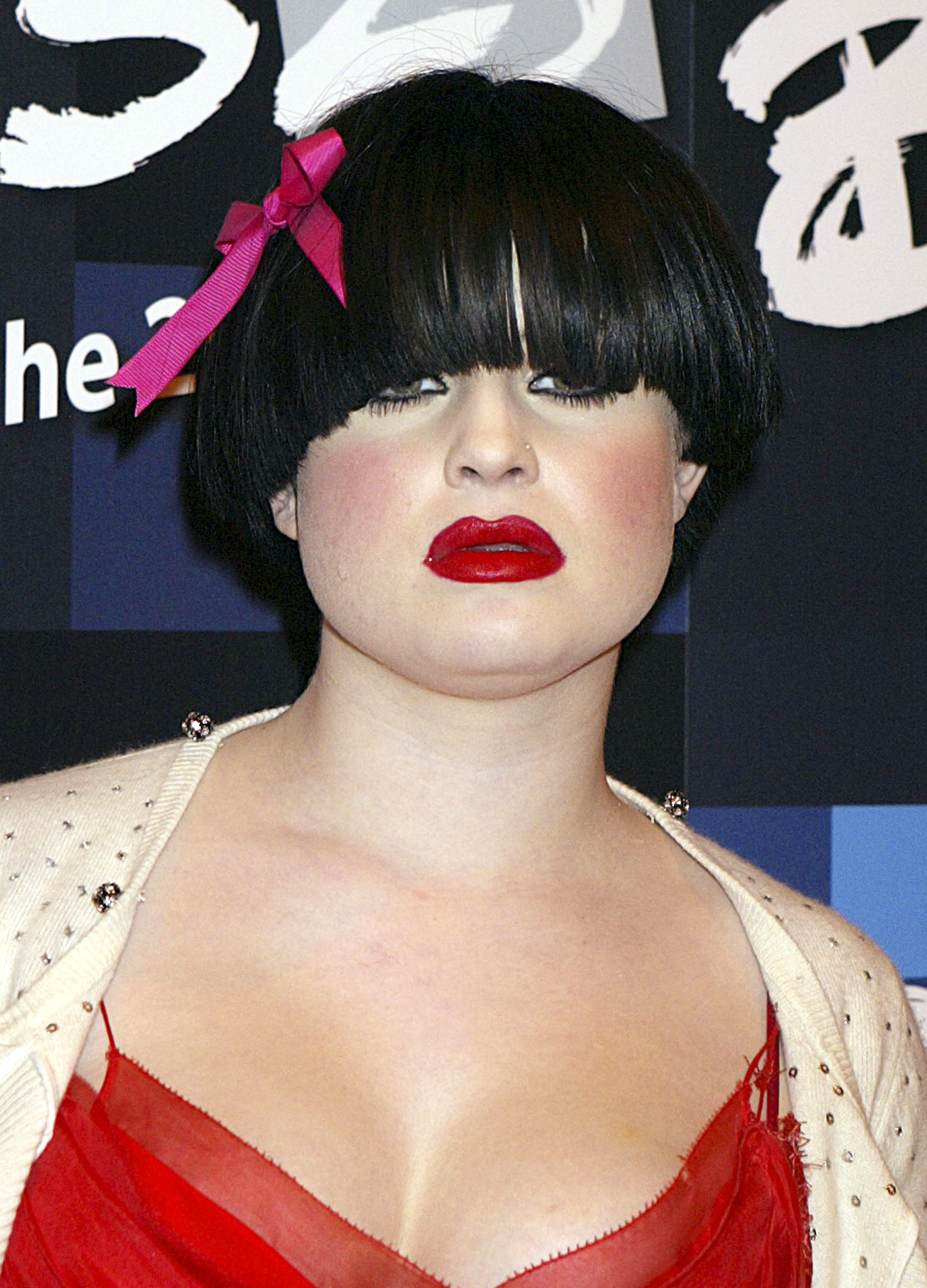 Kelly Osbourne attends the 25th Anniversary BRIT Awards in 2005, continuing her reputation for fearless style experimentation with a theatrical beauty look that reflected the eclectic fashion trends of the era. | Source: Getty Images