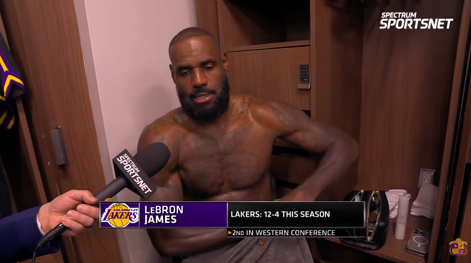 LeBron James adjusting his towel around his waist during the interview. | Source: YouTube/Lakers Nation