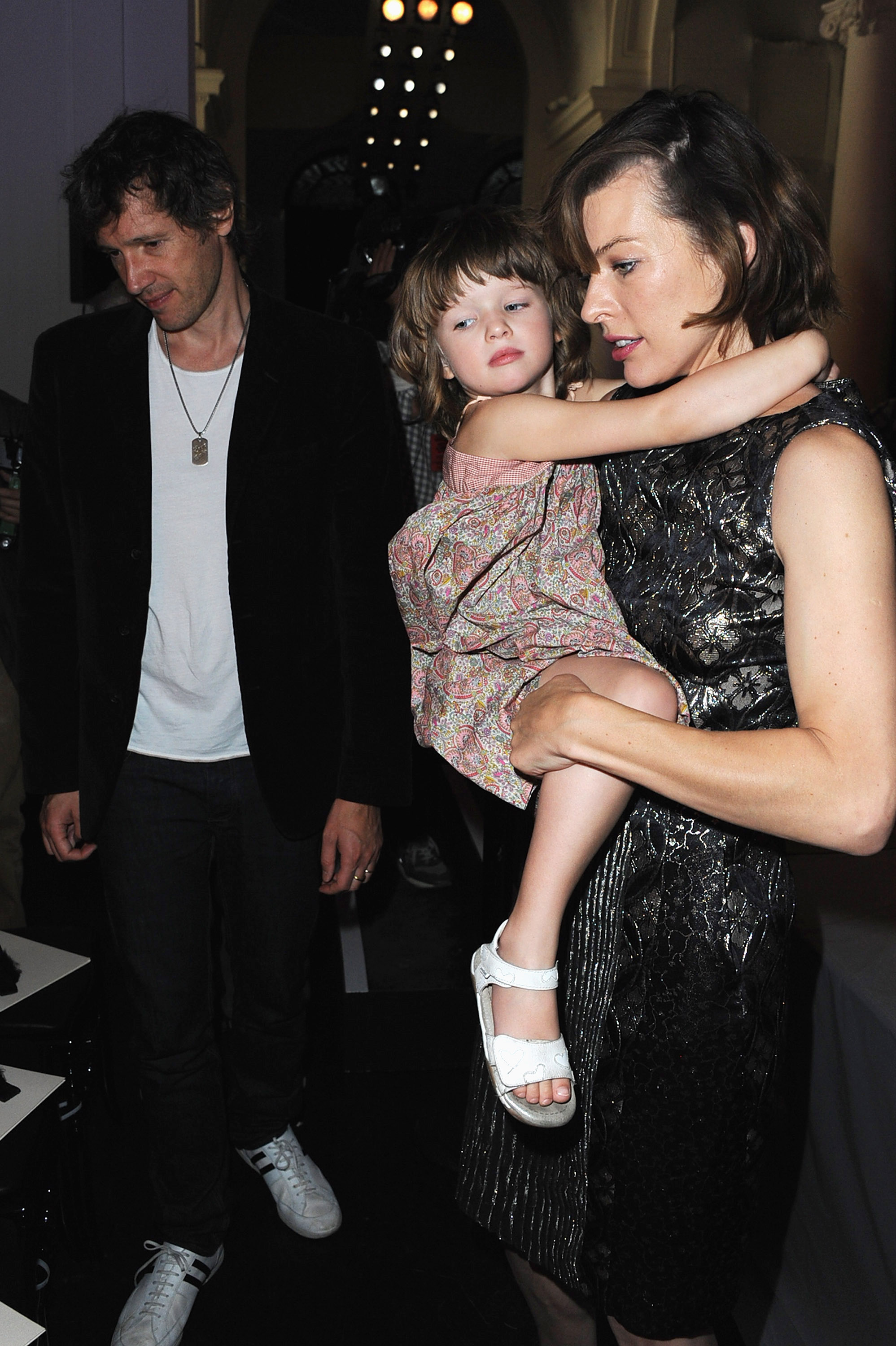 Paul Anderson, 33, Milla Jovovich, 35, and Ever Anderson, 3, attended the Jean Paul Gaultier Haute Couture Fall/Winter 2011/2012 show as part of Paris Fashion Week on July 6, 2011, in France.