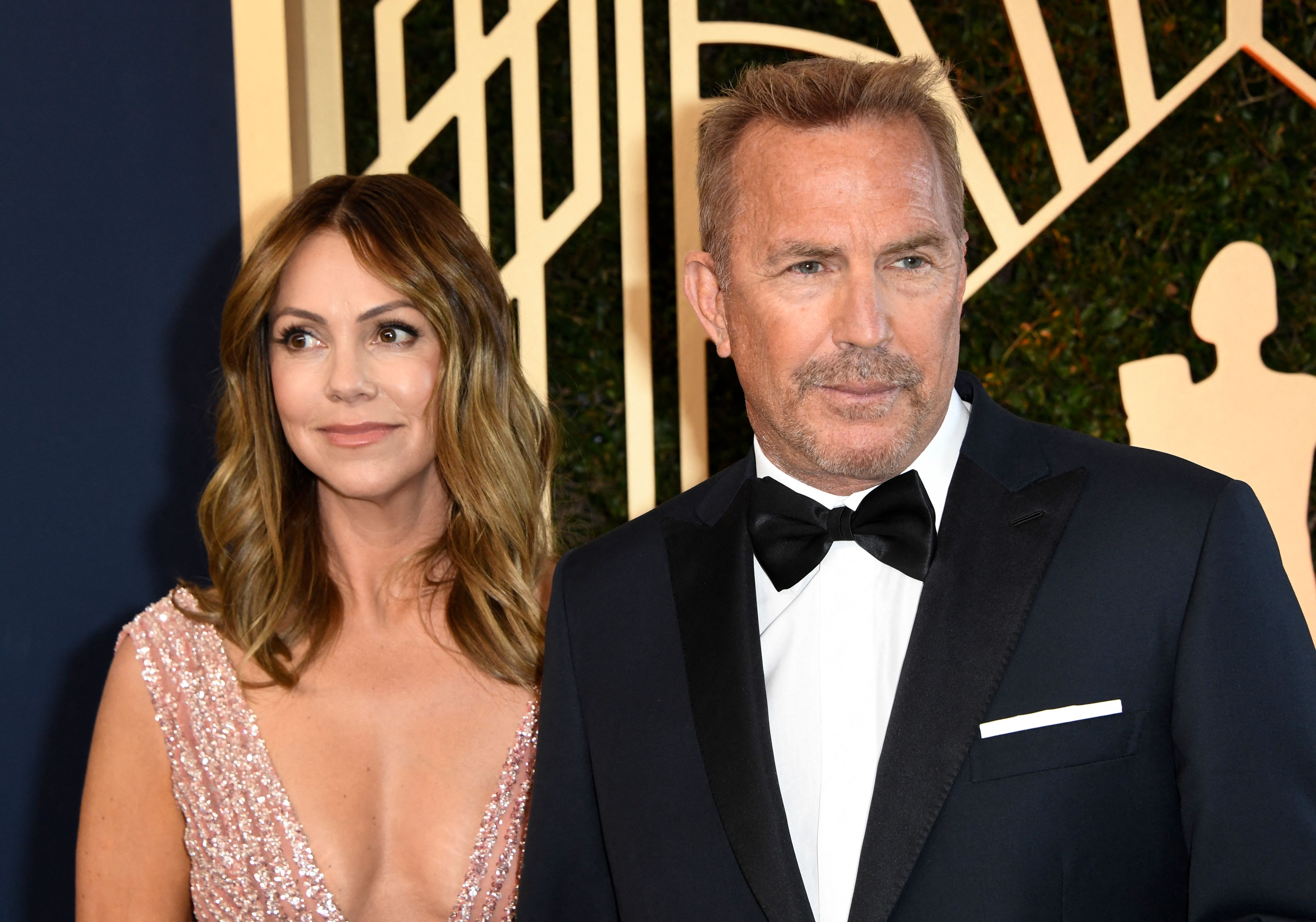 Christine Baumgartner and Kevin Costner at the 28th Annual Screen Actors Guild (SAG) Awards in Santa Monica, California on February 27, 2022. | Source: Getty Images