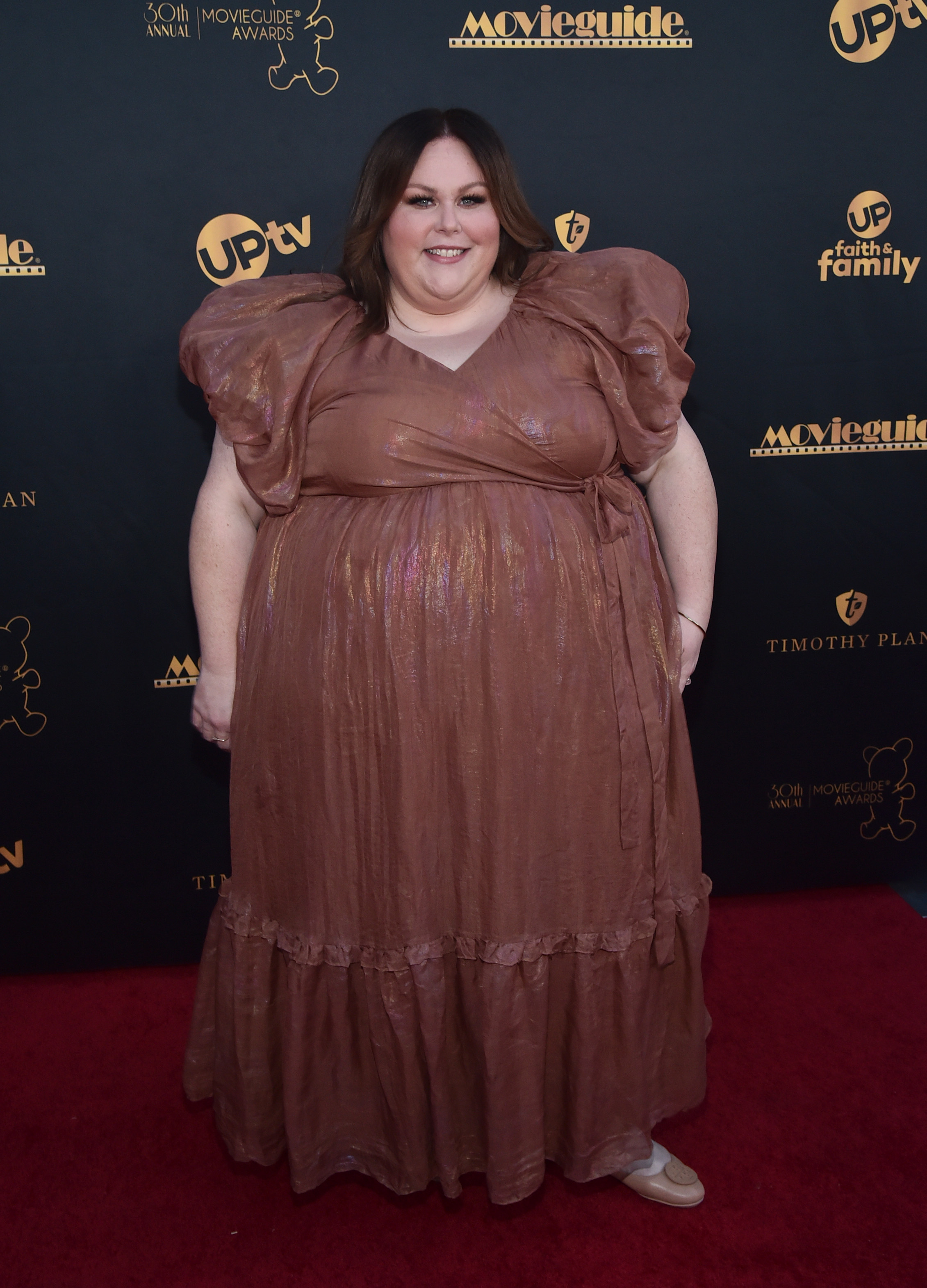 She wore a bronze-brown gown with oversized puff sleeves at the Movieguide Awards. This photo comes shortly before Metz began speaking publicly about making weight lifting a more consistent part of her routine.