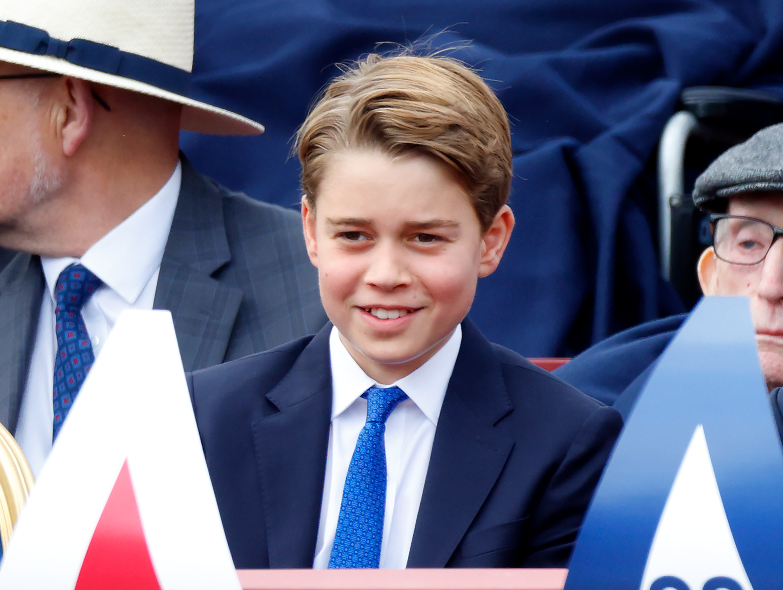 Prince George smiles during a military procession in London marking the 80th anniversary of VE Day on May 5, 2025. Alongside his royal appearances, George was preparing for a new stage in his education. | Source: Getty Images