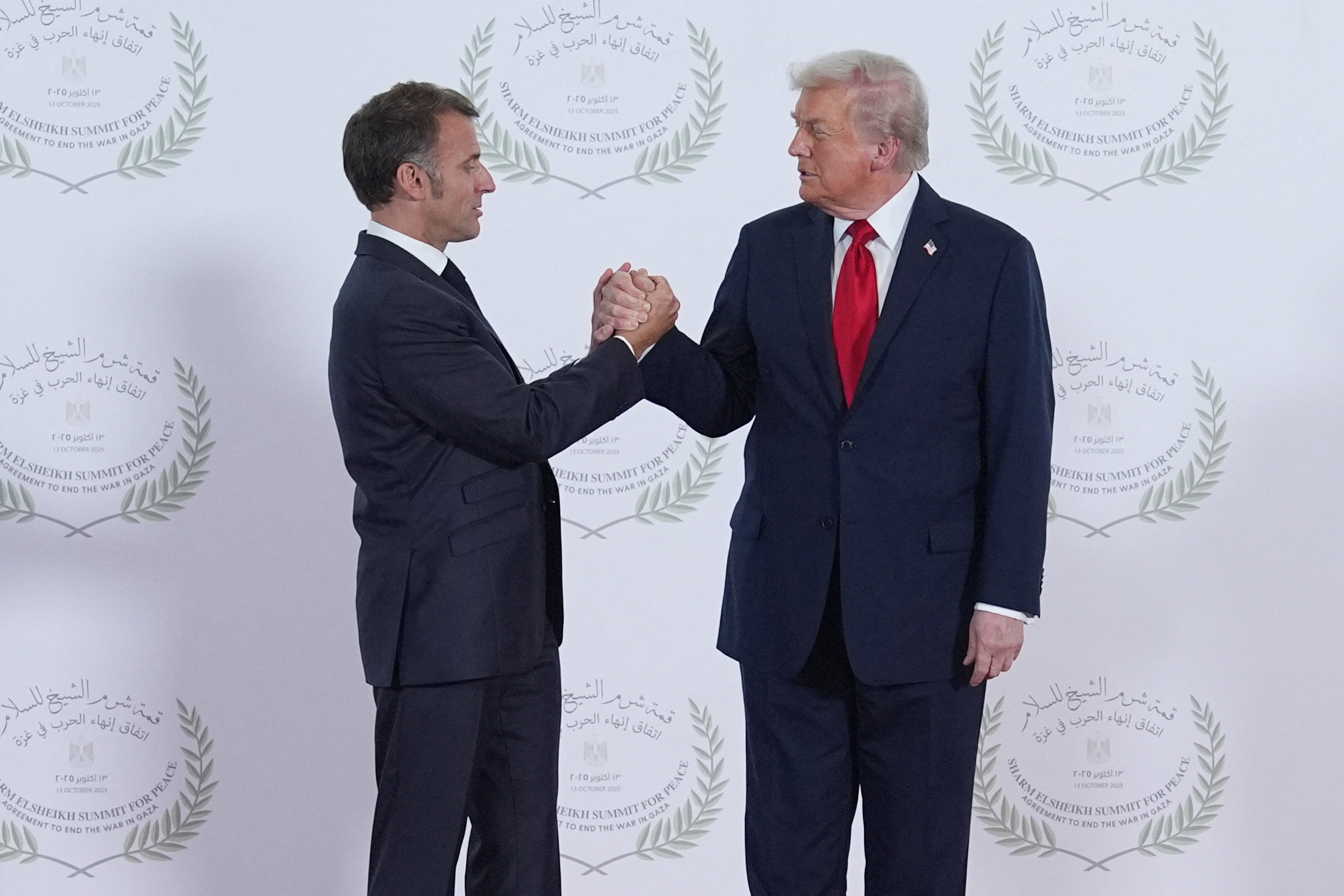 President Donald Trump and French President Emmanuel Macron during a summit on Gaza in Sharm el-Sheikh, Egypt on October 13, 2025 | Source: Getty Images