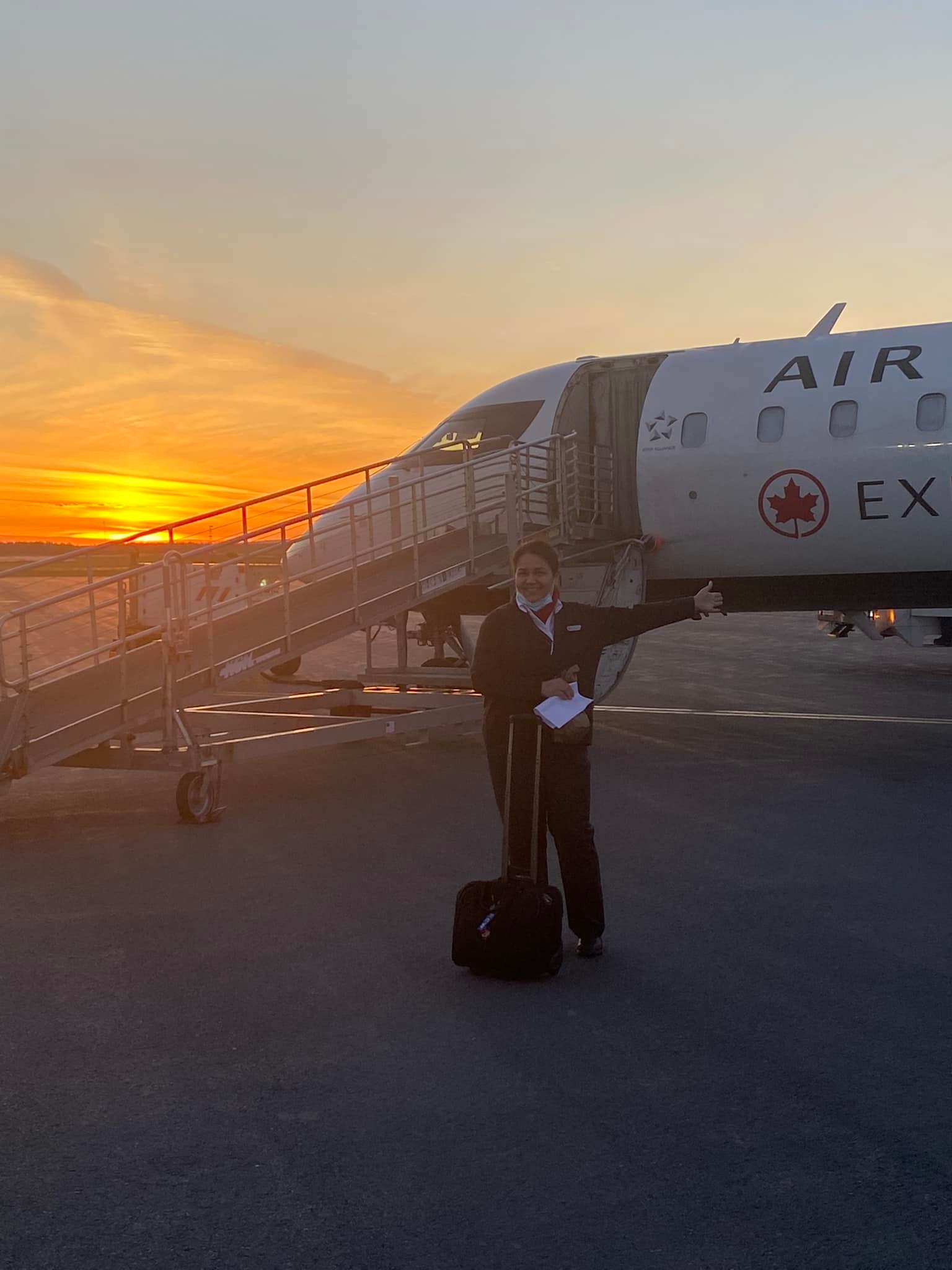 Solange Tremblay in her uniform next to a plane in a post on June 14, 2022 | Source: Facebook/Solange Tremblay