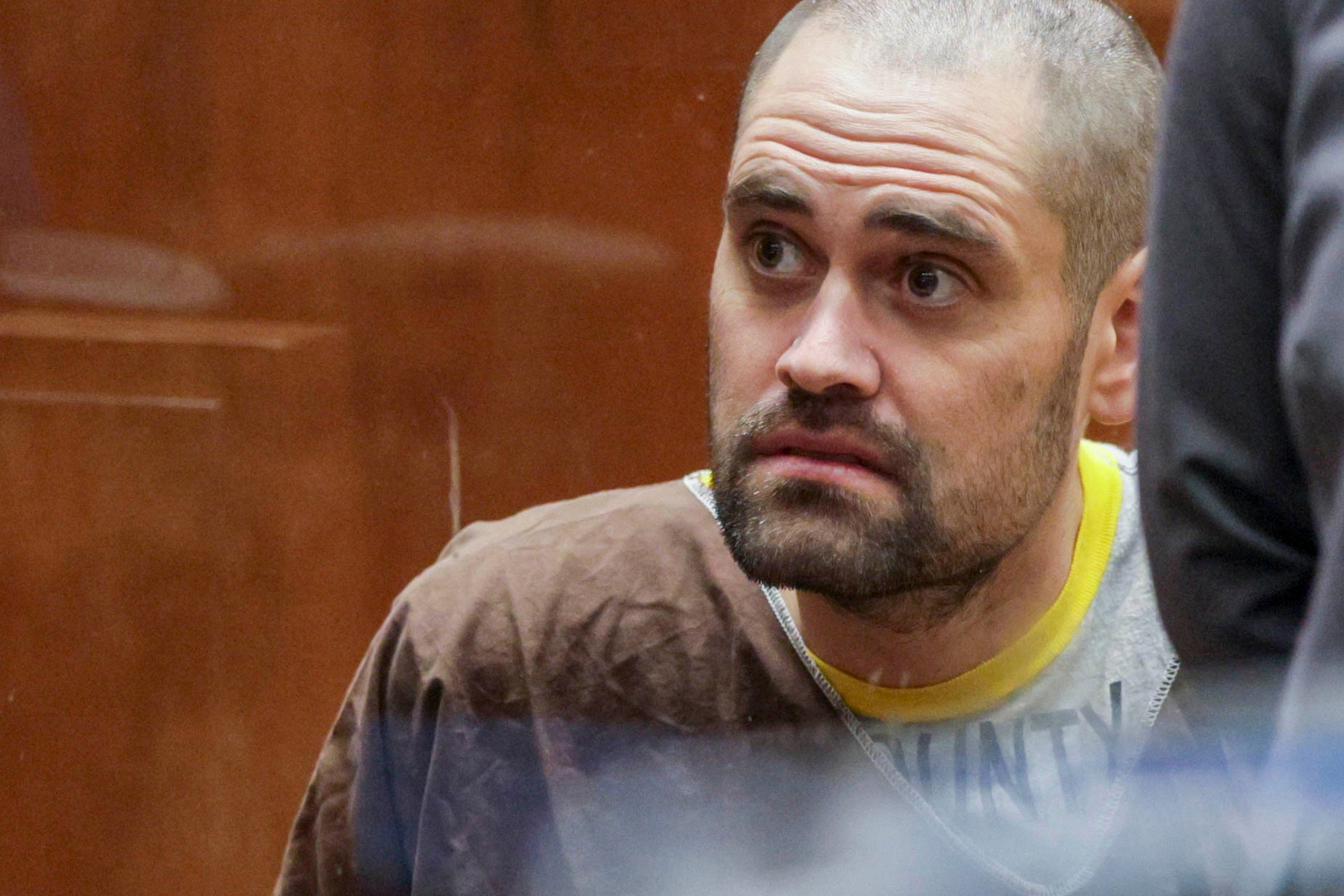 Nick Reiner, with a closely shaved head and trimmed facial hair, glances to the side with a tense expression | Source: Getty Images