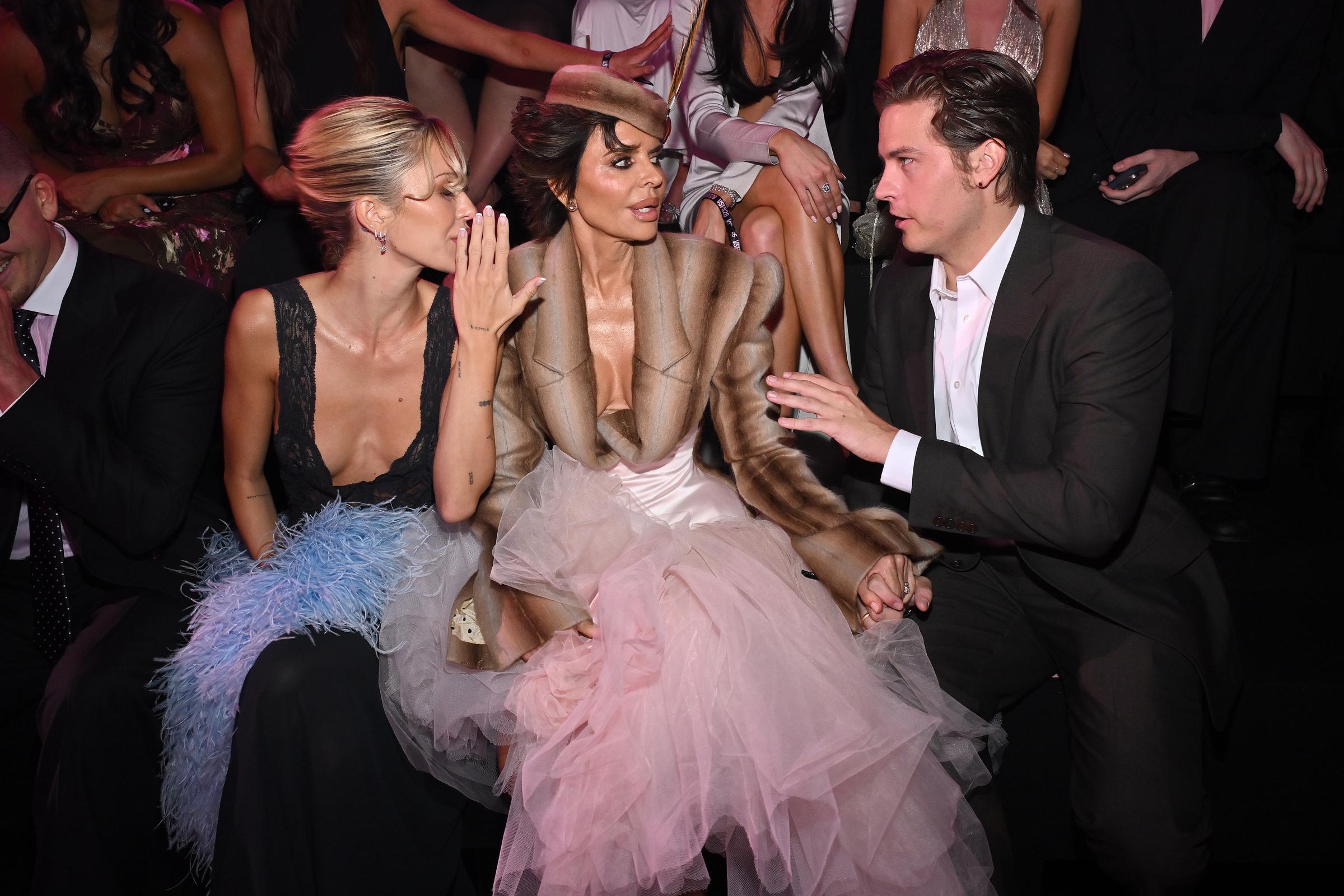 Lisa Rinna sat alongside daughter Delilah Belle Hamlin and actor Dylan Sprouse at the 2026 Victoria’s Secret Fashion Show in Culver City, California, on October 18, as the family gathered to support Amelia Gray Hamlin’s runway appearance. | Source: Getty Images