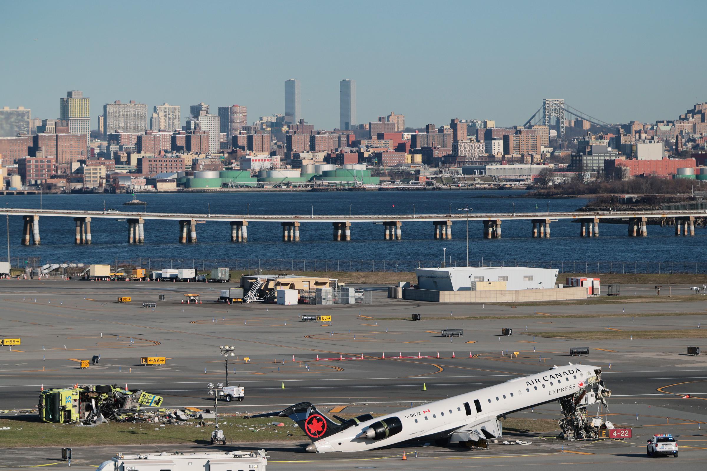 An Air Canada Express CRJ-900 sits on the runway after colliding with a Port Authority fire truck at LaGuardia Airport on March 24, 2026, in New York City | Getty Images