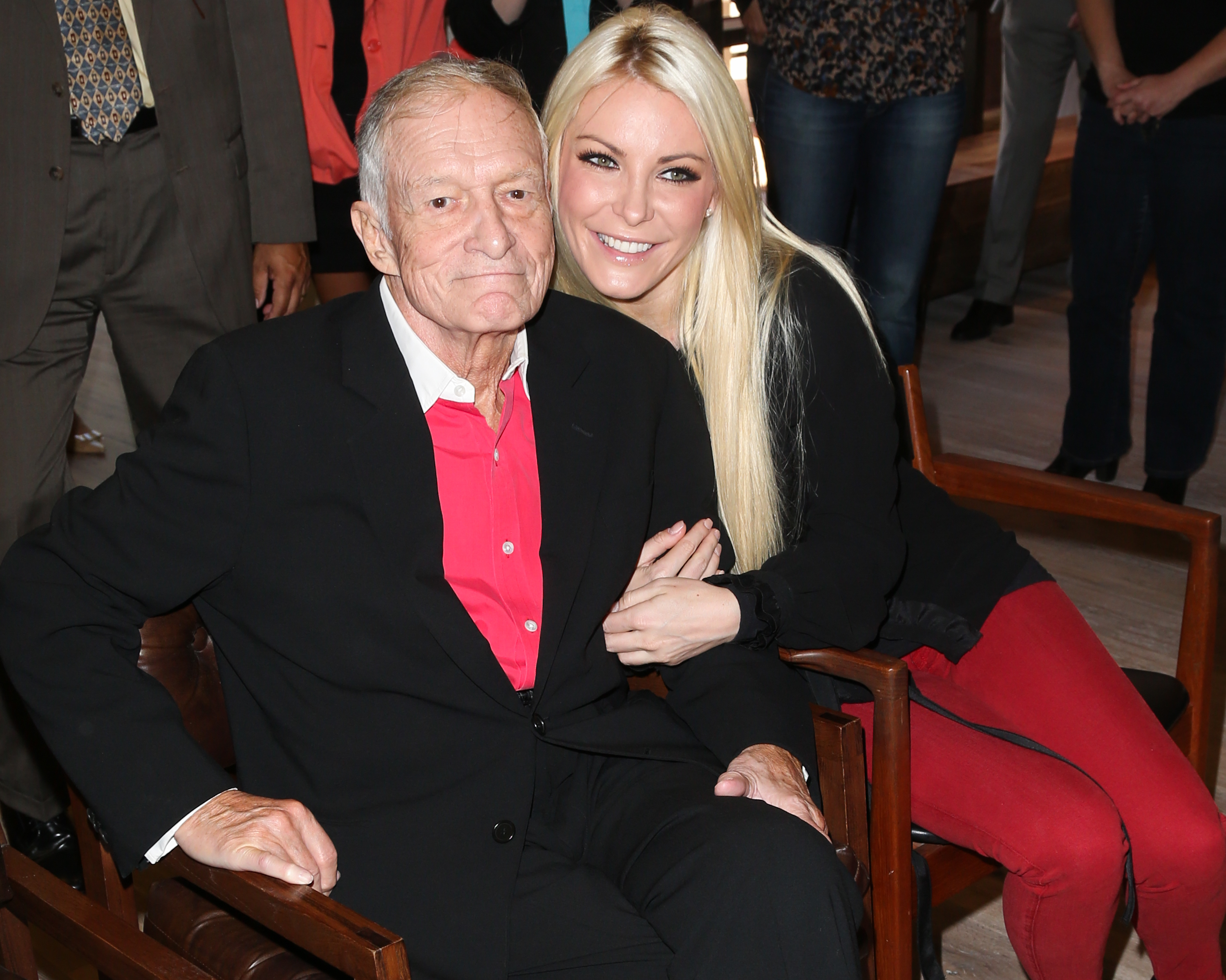 Hugh Hefner and Crystal Harris during The Beverly Hills City Council and Playboy Enterprises, Inc. ribbon cutting ceremony to celebrate the return of Playboy World Headquarters to Beverly Hills on August 7, 2012, in Beverly Hills, California | Source: Getty Images