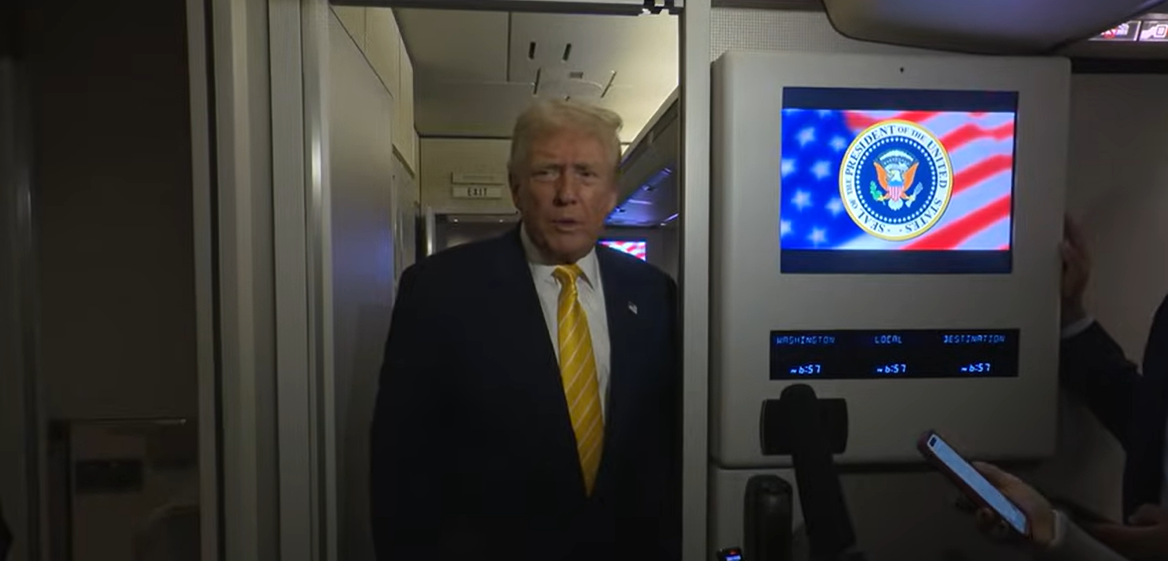 President Donald Trump answers questions from reporters aboard Air Force One, as seen from a video post dated November 15, 2025. | Source: YouTube/TheWhiteHouse