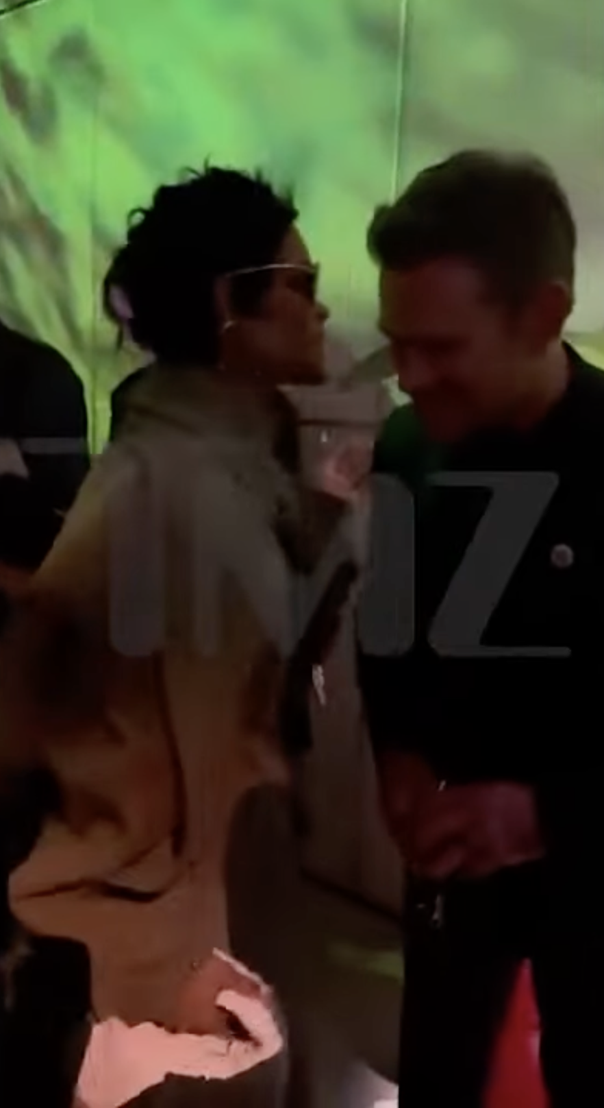 Teyana Taylor chats with a smiling Matt Damon during "The Rip" afterparty in New York City | Source: YouTube/TMZShortClips