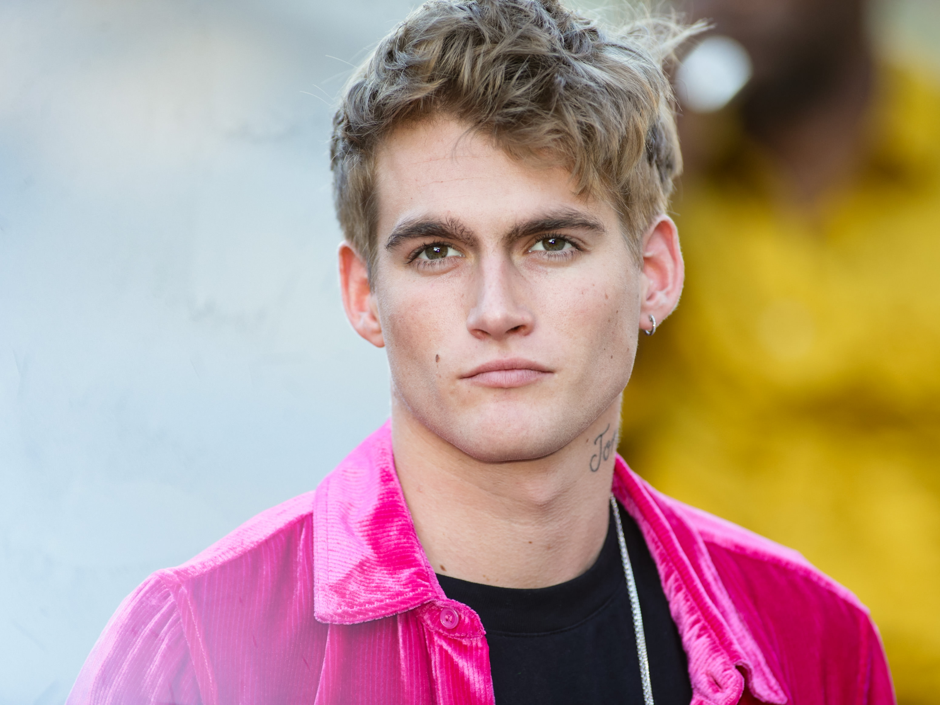 Presley Gerber turned heads outside the 2019 CFDA Fashion Awards at the Brooklyn Museum on June 3, 2019, in the Brooklyn borough of New York City. The young model made a bold style statement in a vibrant hot pink crushed velvet button-up shirt layered over a simple black tee, accenting the high-fashion look with a silver chain necklace, a hoop earring, and his tousled dirty-blonde hair. | Source: Getty Images