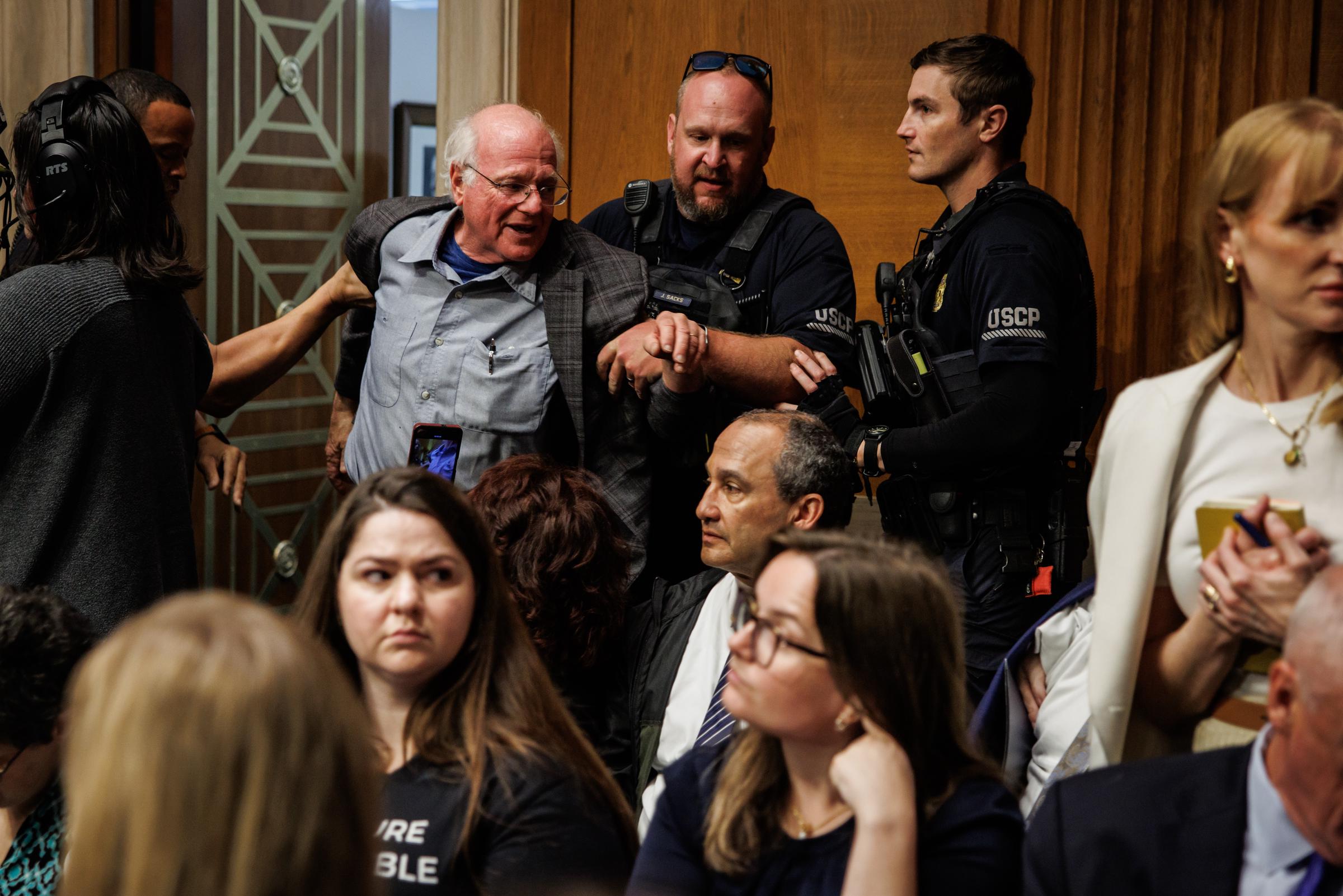 The U.S. Capitol Police detains Ben Cohen for disrupting proceedings during a hearing with Secretary of Health and Human Services Robert F. Kennedy Jr. on May 14, 2025, in Washington, D.C. | Source: Getty Images