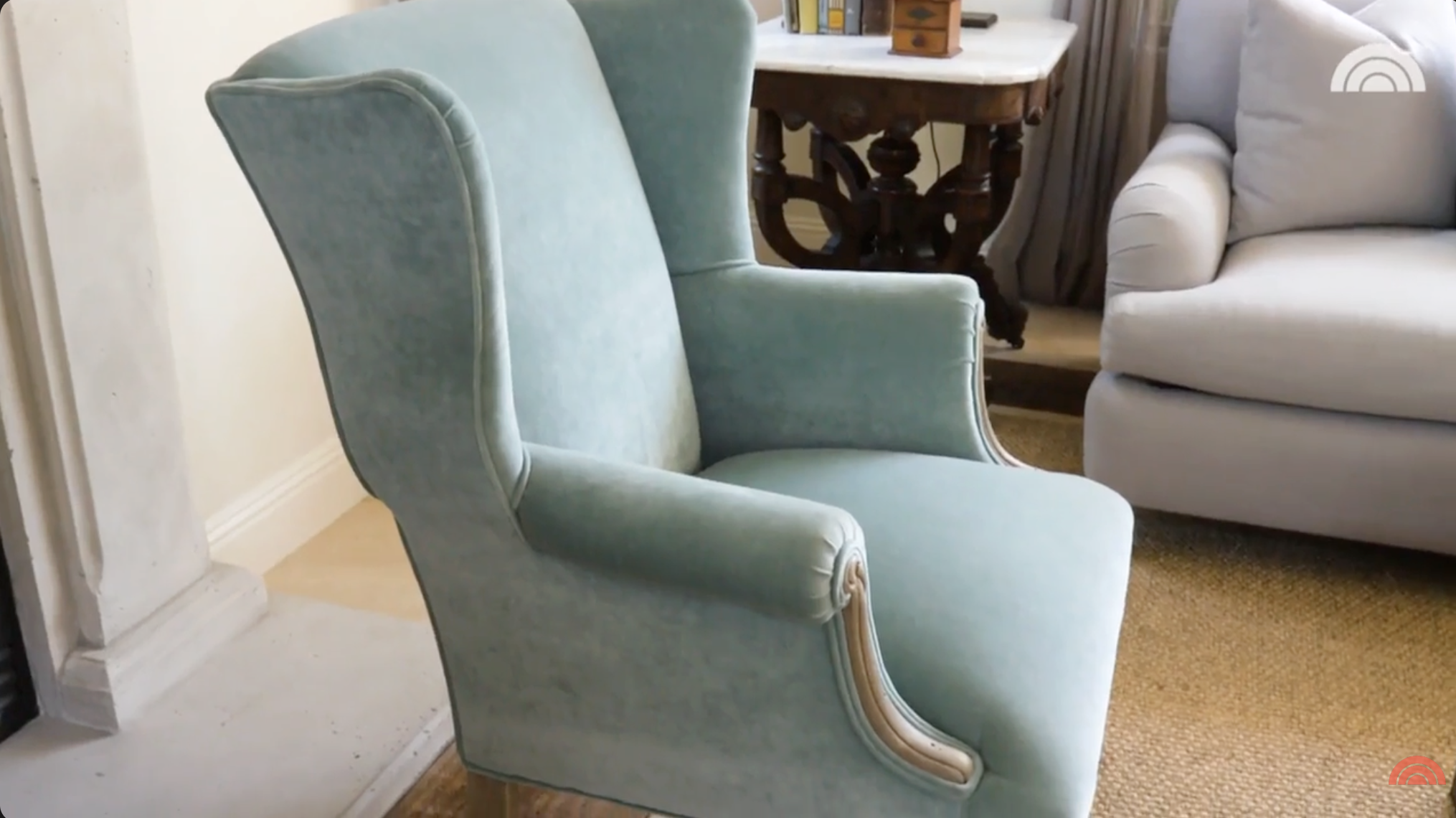 A close-up view of the light blue velvet arm chair inside Tamera Mowry's living space. | Source: YouTube/Today