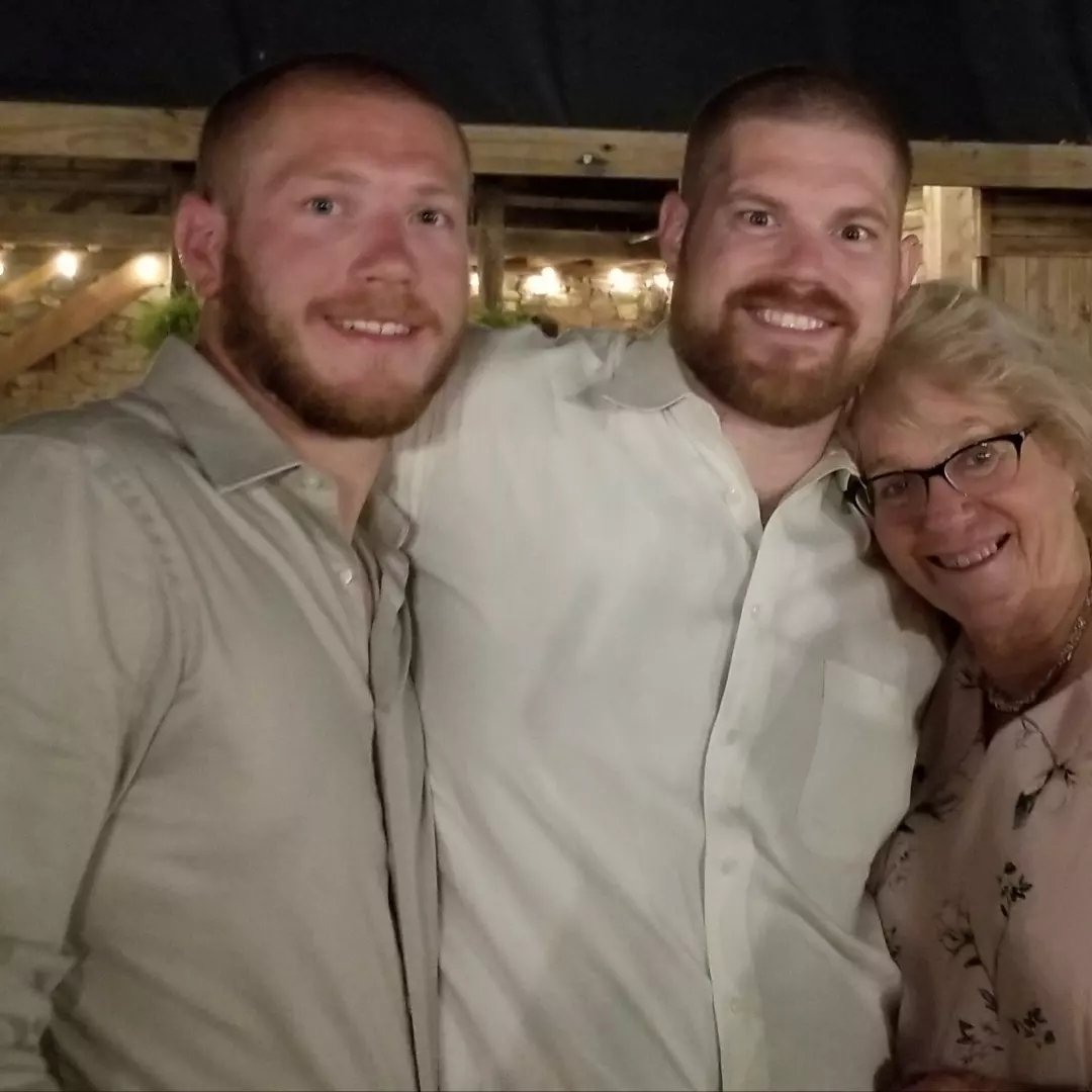 Janet Martin Swallow seen with her sons in a picture dated September 2023 | Source: Facebook/janet.swallow.31