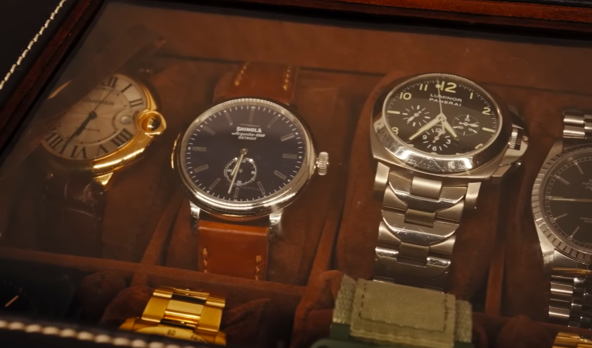 Mark's accessories get their own careful display. The closet is not just spacious — it is meticulously curated. | Source: YouTube/Architectural Digest