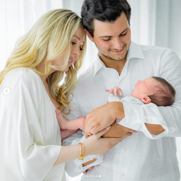 Tiffany Trump and Michael Boulos cradling their newborn son, Alexander Trump Boulos, posted on July 3, 2025. | Source: Instagram/tiffanytrump