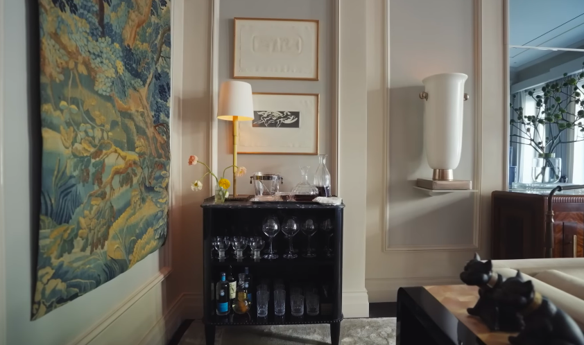 The room's bar setup adds a relaxed note to the otherwise refined space. It is one of those details that makes the house feel ready for guests at any moment. | Source: YouTube/Architectural Digest