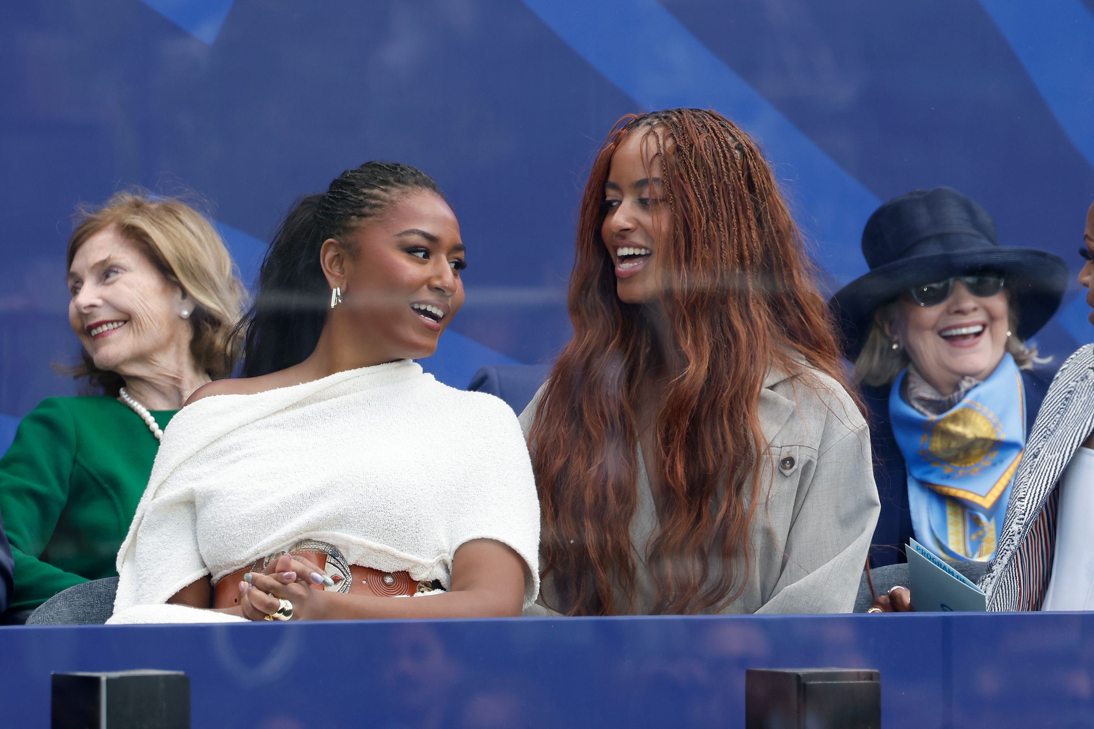 Sasha Obama and Malia Obama attend the dedication ceremony for the opening of the Barack Obama Presidential Center, in John Lewis Plaza, on June 18, 2026 in Chicago, Illinois. | Source: Getty Images