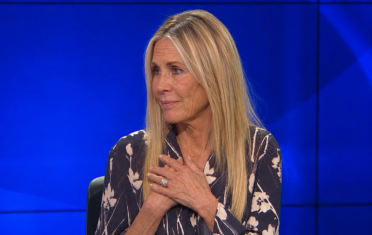 A heartfelt gesture gives this interpretation a more personal feel, imagining Joan Van Ark reflecting on her life and career during a television appearance. Rather than emphasizing transformation alone, the AI presents a version of the actress whose warmth and expressive presence remain as recognizable as ever. | Source: ChatGPT