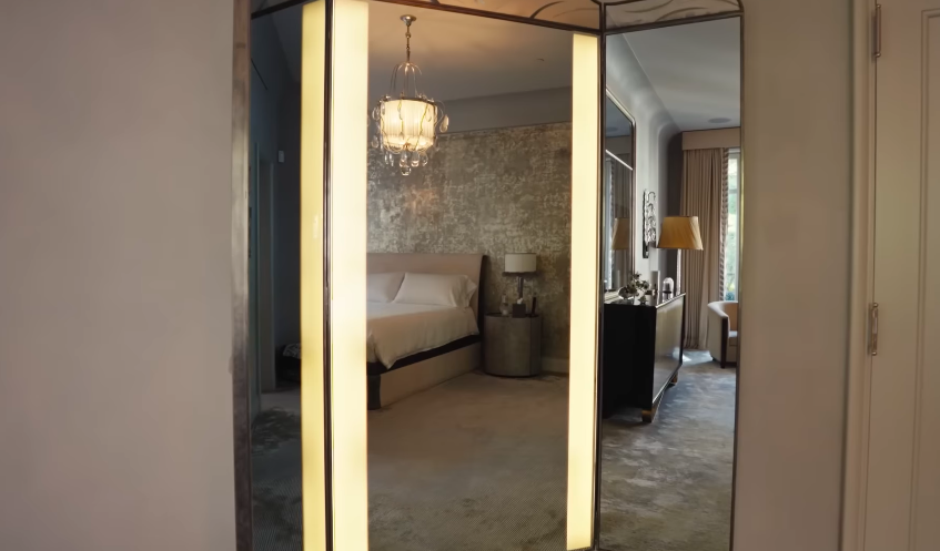 The mirrored wardrobe reinforces the home's Art Deco influence. It also adds a touch of dressing-room glamour to the bedroom. | Source: YouTube/Architectural Digest