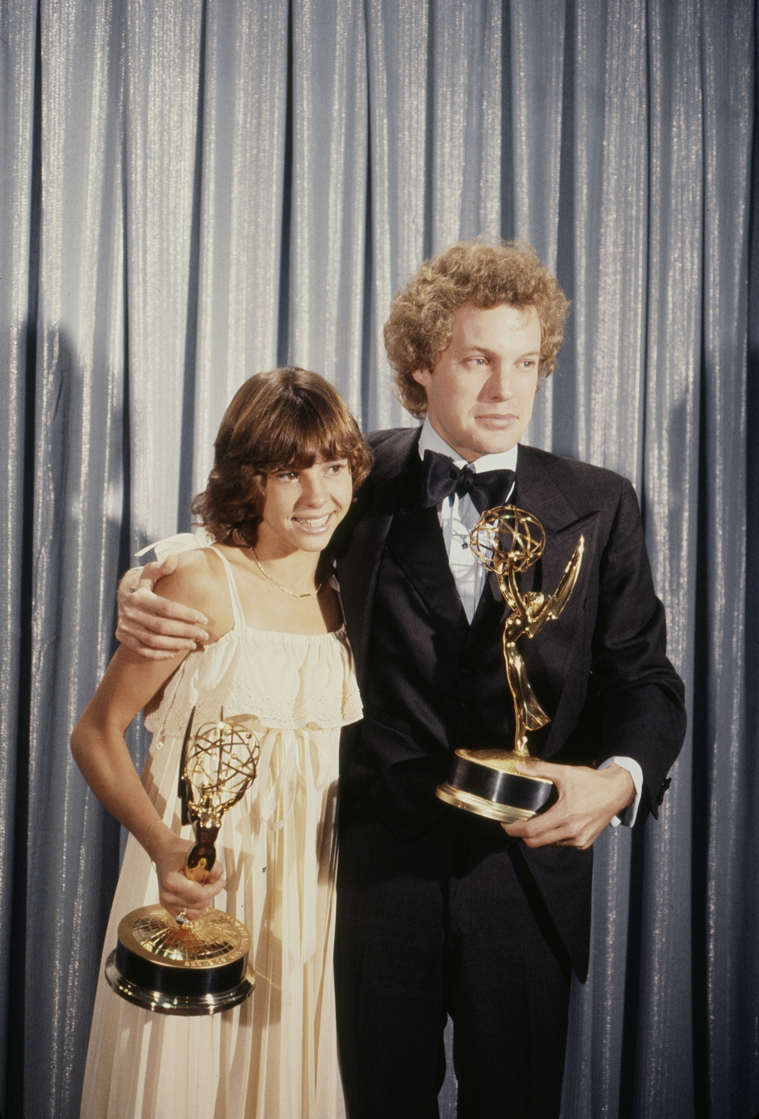 Kristy McNichol earned two Emmy Awards for her portrayal of Buddy Lawrence in "Family." In this photo, she posed with Gary Frank and their awards at the Primetime Emmy Awards at the Pasadena Civic Auditorium in Pasadena, California, in 1977. | Source: Getty Images