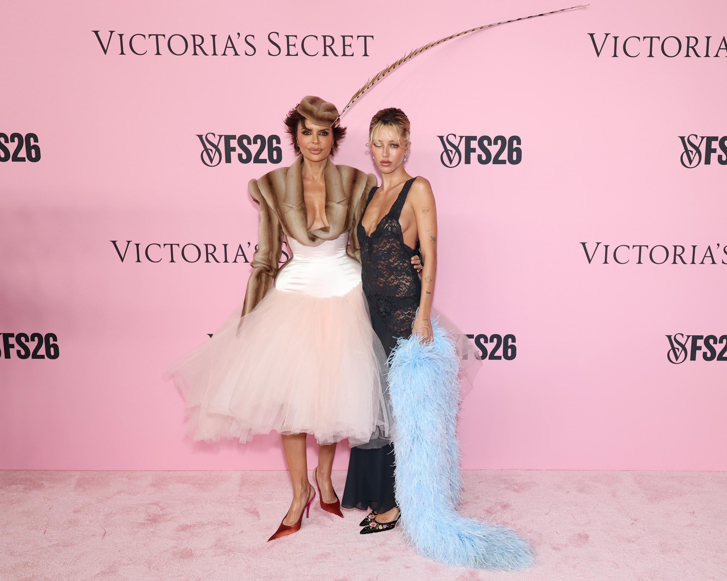 Lisa Rinna posed alongside daughter Delilah Belle Hamlin on the pink carpet at the 2026 Victoria’s Secret Fashion Show, with both sporting statement-making looks for the star-studded event. | Source: Getty Images
