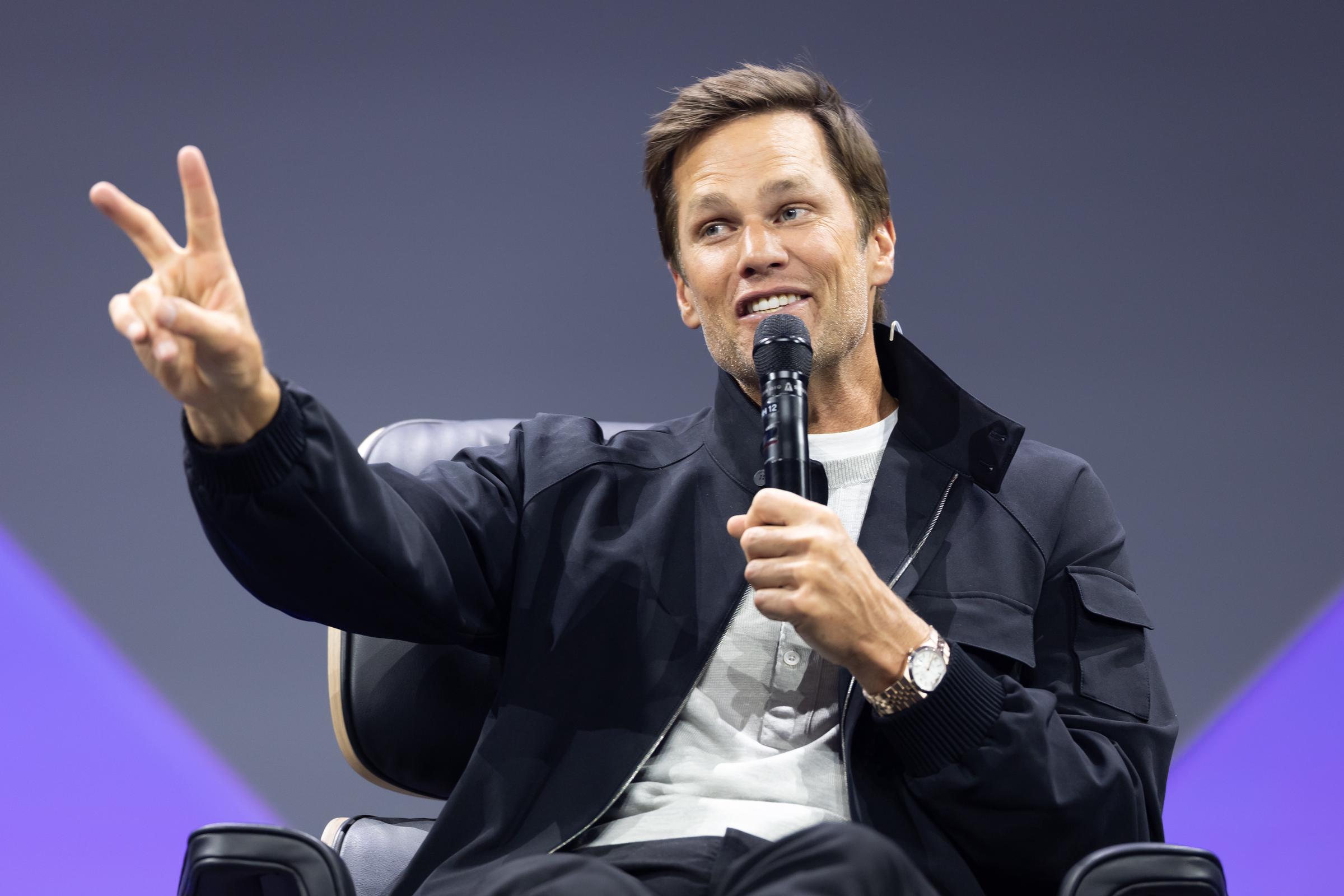 Tom Brady gestures while speaking onstage during day two of the OMR Festival in Hamburg, Germany, on May 6, 2026 | Source: Getty Images