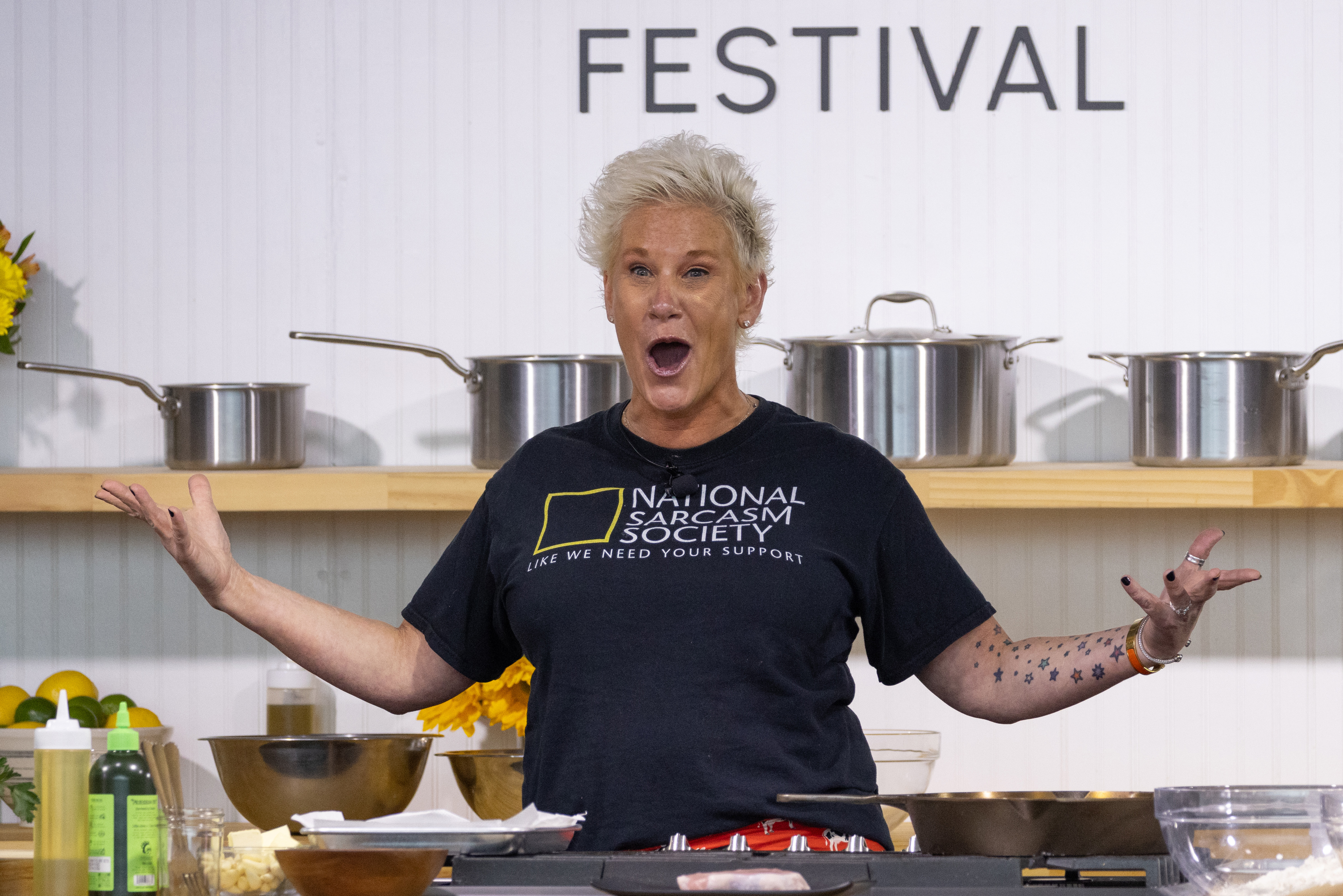 Chef Anne Burrell enthusiastically demonstrates a recipe on stage during the 2023 Austin Food & Wine Festival in Austin, Texas, on November 5, 2023 | Source: Getty Images