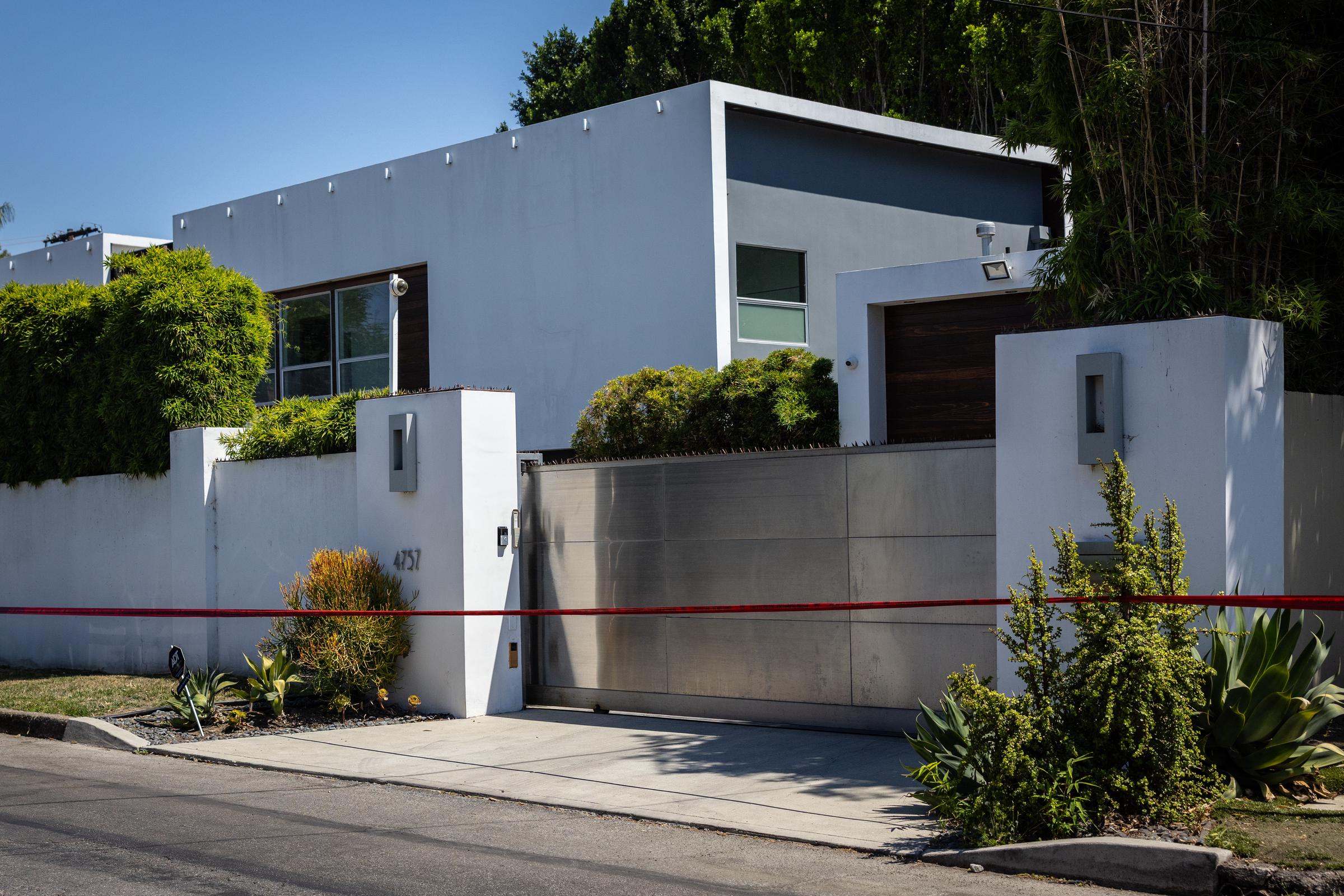 Los Angeles Police Department officials secure the home where Robin Kaye an "American Idol" music supervisor and her husband Thomas Deluca were found on Tuesday, July 15, 2025 in Encino, CA | Source: Getty Images