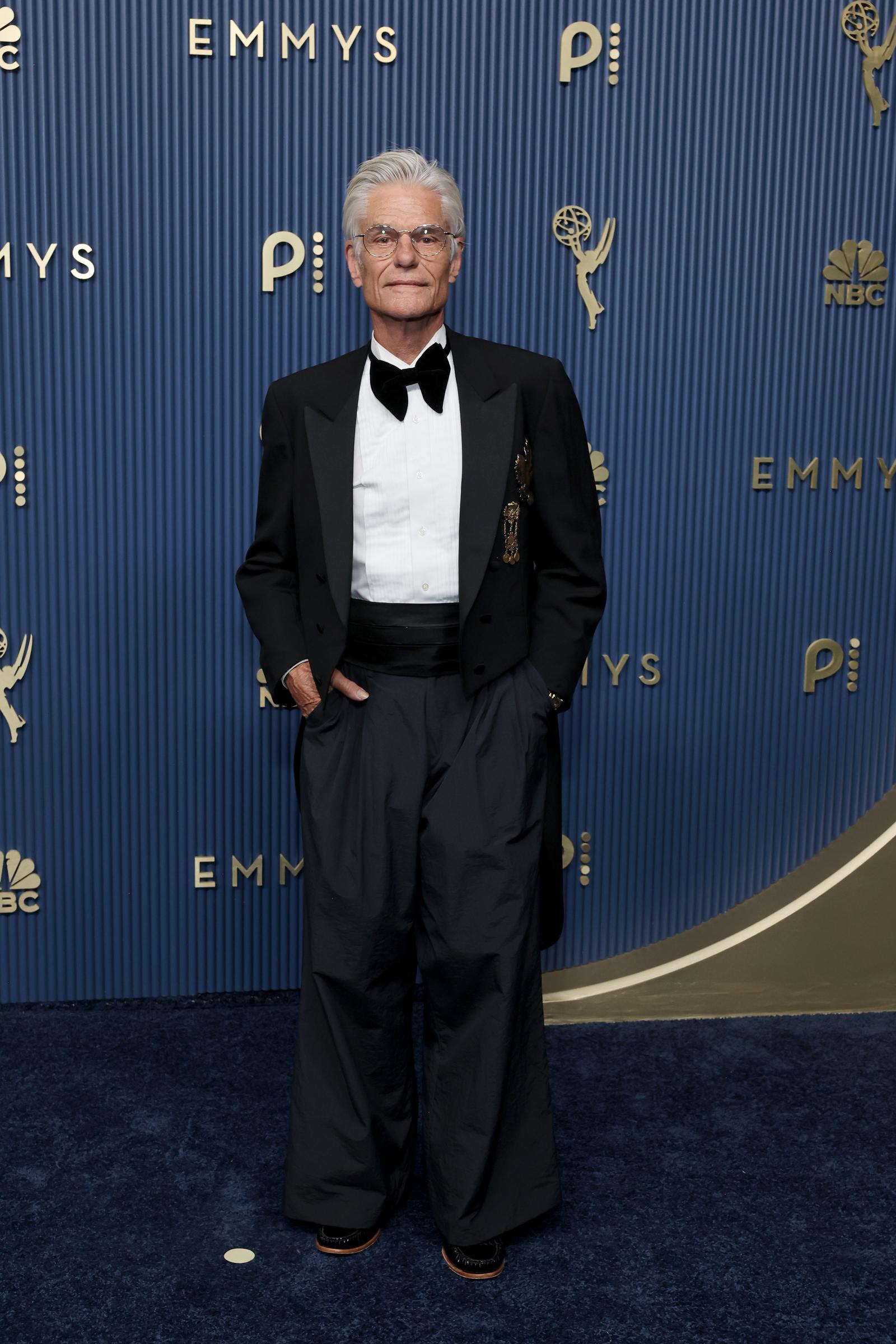 Harry Hamlin's formalwear sparked one of the more specific online debates of the evening, with viewers repeatedly zeroing in on the cut of his trousers. Some found the proportions unflattering, while others praised his glasses, haircut, and overall look. | Source: Getty Images