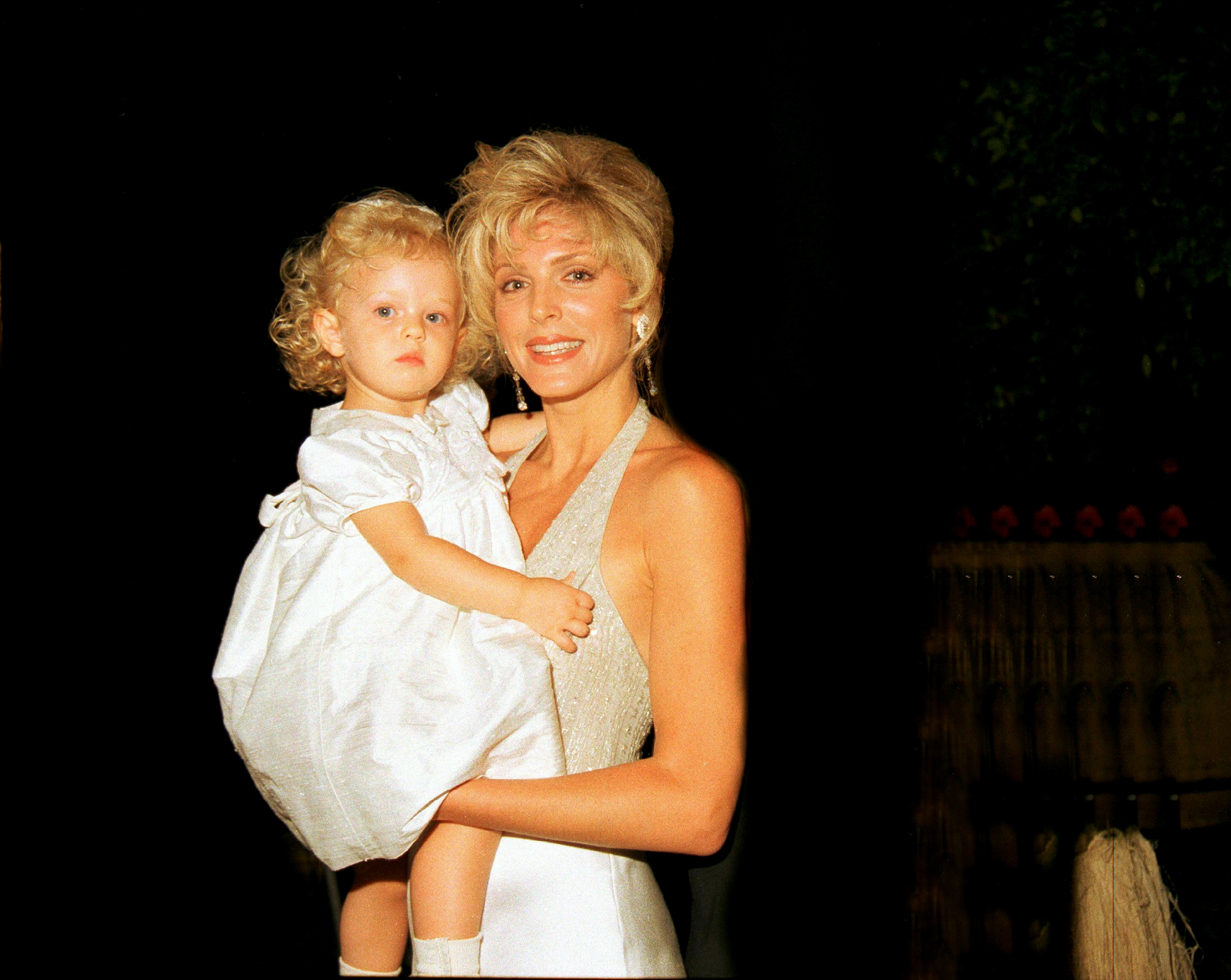 Portrait of the actress as she holds her daughter, taken on April 22, 1995