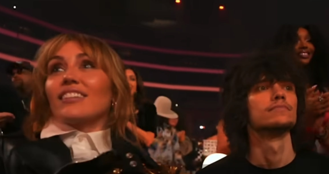 Miley Cyrus and friend react to Lady Gaga winning Best Pop Vocal Album for "MAYHEM" during the 68th Annual Grammy Awards at Crypto.com Arena on February 1, 2026, in Los Angeles | Source: YouTube/Page Six