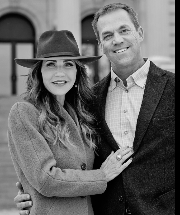 A polished black-and-white portrait of Kristi and Bryon Noem—timeless, composed, and quietly affectionate. | Source: Facebook/KristiNoem