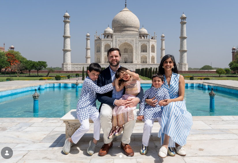 JD Vance and Usha pose with their children seated in front of the Taj Mahal’s reflecting pool, smiling for a family photo with the monument prominently in the background. | Source: Instagram/vp
