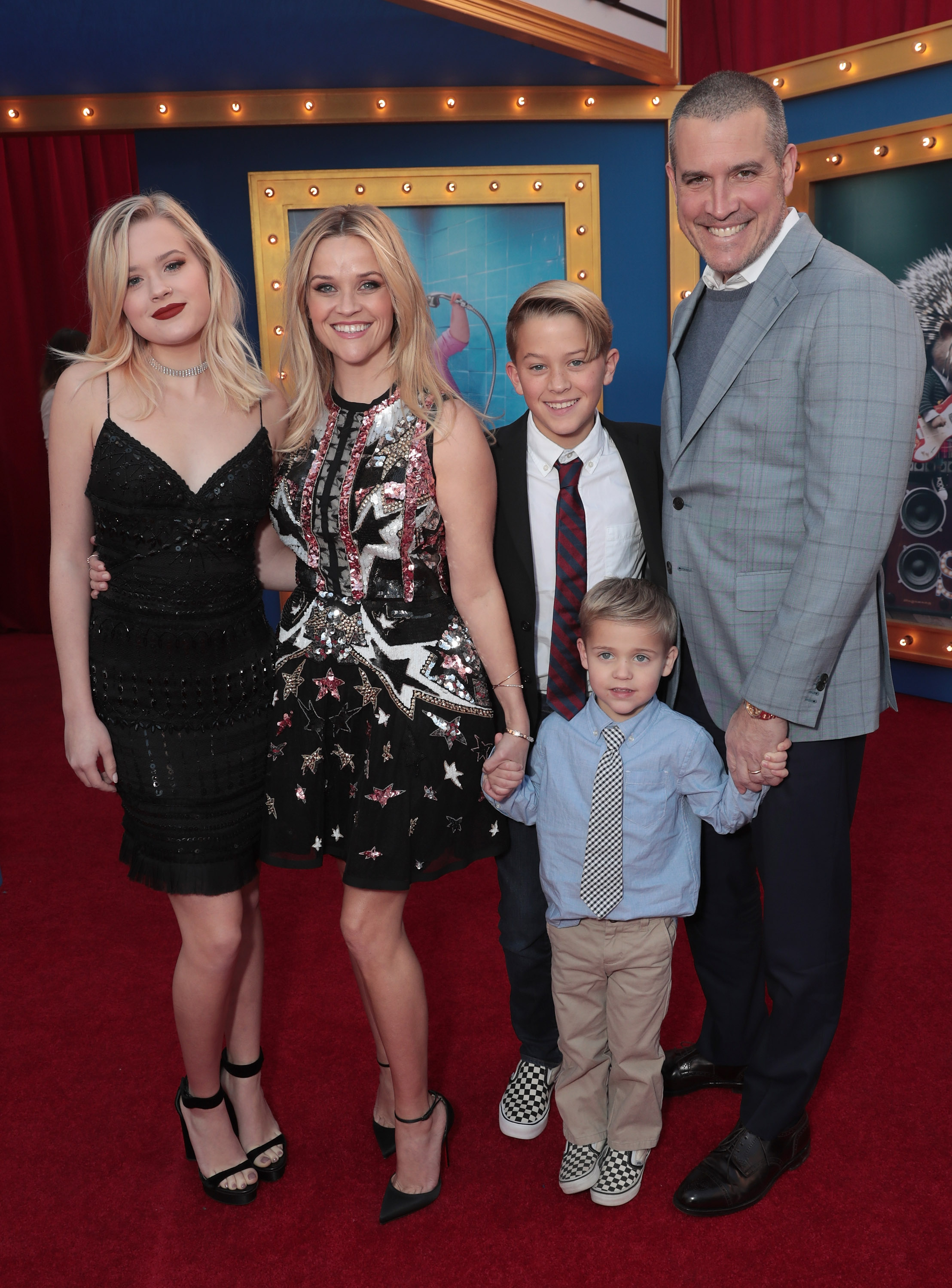 Ava Phillippe, Reese Witherspoon, Deacon Phillippe, Tennessee James Toth, and Jim Toth smile together at the premiere of Universal Pictures' "Sing" in Los Angeles. | Source: Getty Images
